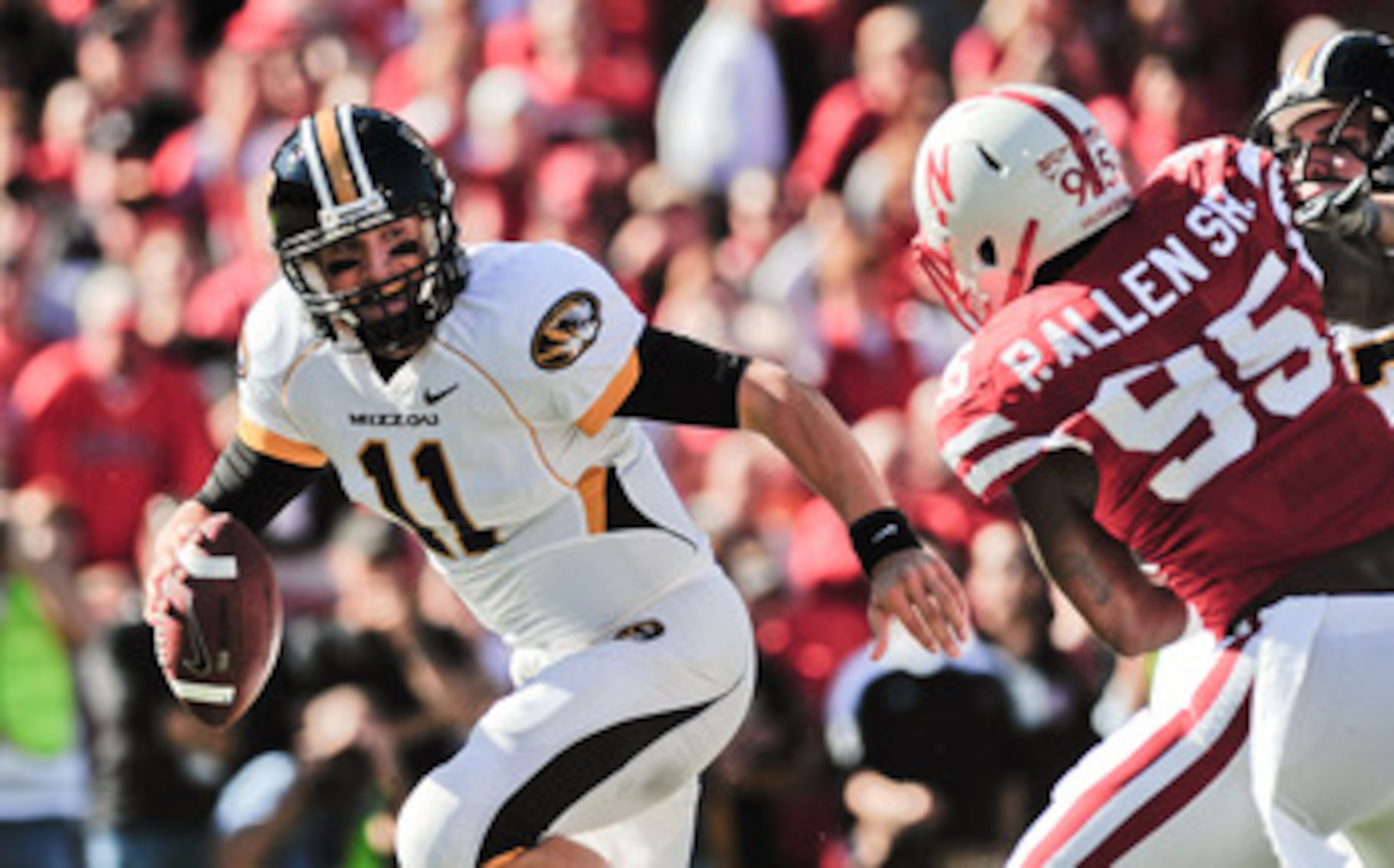 LINCOLN, NE - OCTOBER 30: Quarterback Blaine Gabbert #11 of the Missouri Tigers tries to avoid defensive end Pierre Allen #95 of the Nebraska Cornhuskers during first half action of their game at Memorial Stadium on October 30, 2010 in Lincoln, Nebraska. 