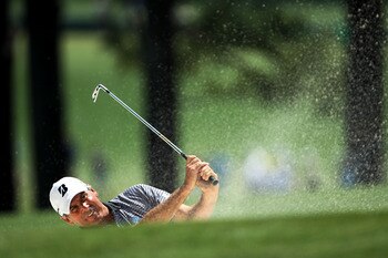 AUGUSTA, GA - APRIL 10:  Fred Couples his a bunker shot on the first hole during the final round of the 2011 Masters Tournament on April 10, 2011 in Augusta, Georgia.  (Photo by Jamie Squire/Getty Images)