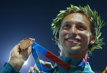 ATHENS - AUGUST 18: Bronze medalist Ian Thorpe of Australia celebrate on the podium during the men's swimming 100 metre freestyle event on August 18, 2004 during the Athens 2004 Summer Olympic Games at the Main Pool of the Olympic Sports Complex Aquatic C