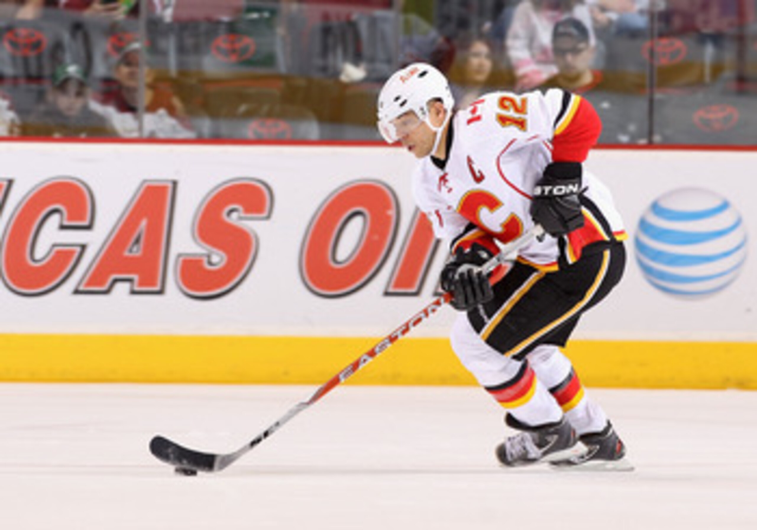 GLENDALE, AZ - MARCH 10:  Jarome Iginla #12 of the Calgary Flames skates with the puck during the NHL game against the Phoenix Coyotes at Jobing.com Arena on March 10, 2011 in Glendale, Arizona.  The Coyotes defeated the Flames 3-0.  (Photo by Christian P