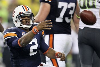 GLENDALE, AZ - JANUARY 10:  Cameron Newton #2 of the Auburn Tigers tosses the ball after being sacked by the Oregon Ducks during the Tostitos BCS National Championship Game at University of Phoenix Stadium on January 10, 2011 in Glendale, Arizona.  (Photo