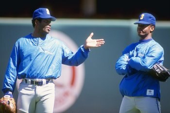 1990:  Ken Griffey Jr. of the Seattle Mariners stands with his father Ken Griffey Sr. during a game. Mandatory Credit: Ken Levine  /Allsport