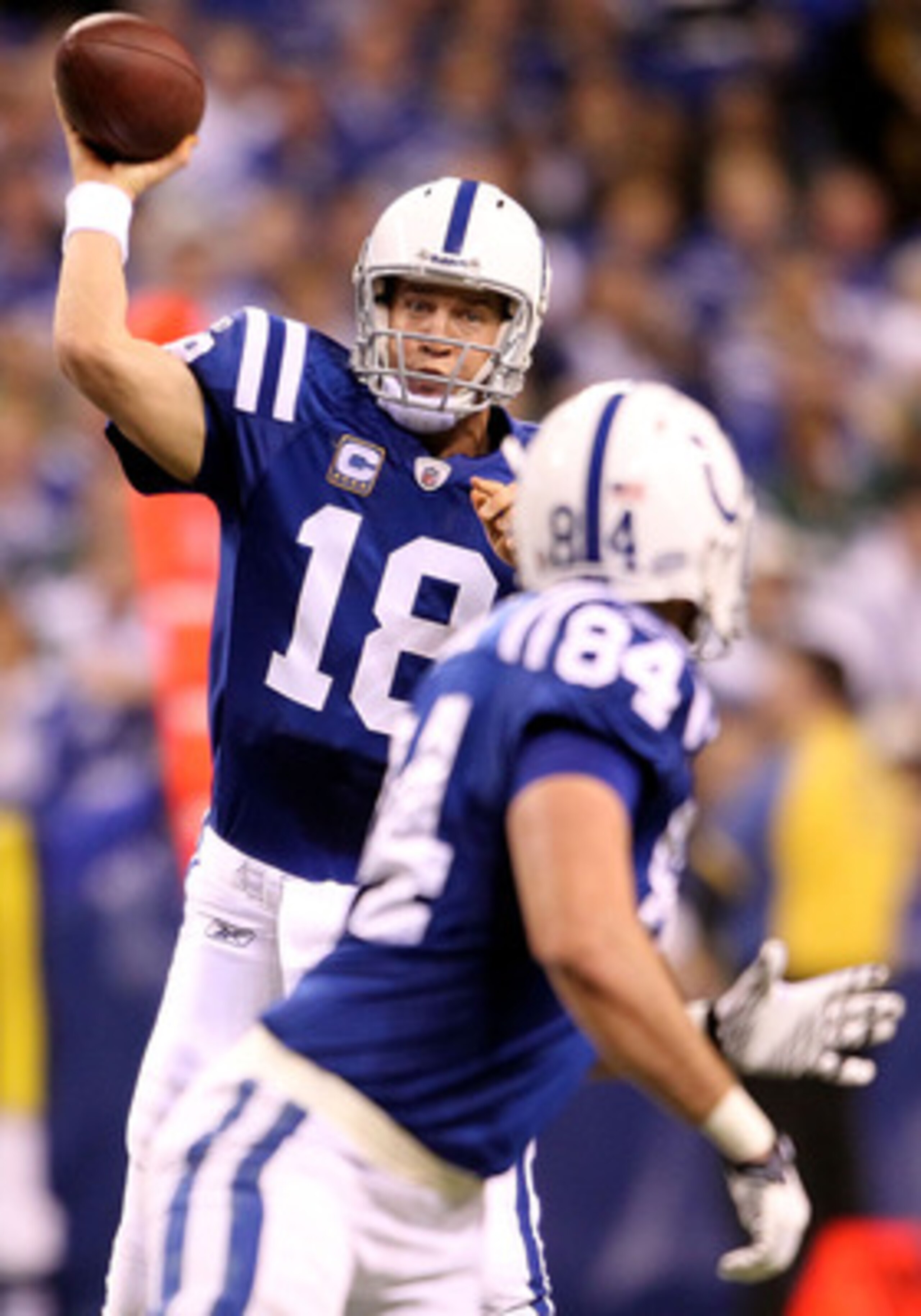 INDIANAPOLIS, IN - JANUARY 08: Peyton Manning #18 of the Indianapolis Colts attempts to pass the ball to Jacob Tamme #84 against the New York Jets during their 2011 AFC wild card playoff game at Lucas Oil Stadium on January 8, 2011 in Indianapolis, India INDIANAPOLIS, IN - JANUARY 08: Peyton Manning #18 of the Indianapolis Colts attempts to pass the ball to Jacob Tamme #84 against the New York Jets during their 2011 AFC wild card playoff game at Lucas Oil Stadium on January 8, 2011 in Indianapolis, India
