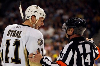 TAMPA, FL - APRIL 18: Jordan Staal #11 of the Pittsburgh Penguins chats with NHL Referee Dennis LaRue #14 during a break in the action against the Tampa Bay Lightning in Game Three of the Eastern Conference Quarterfinals during the 2011 NHL Stanley Cup Pl