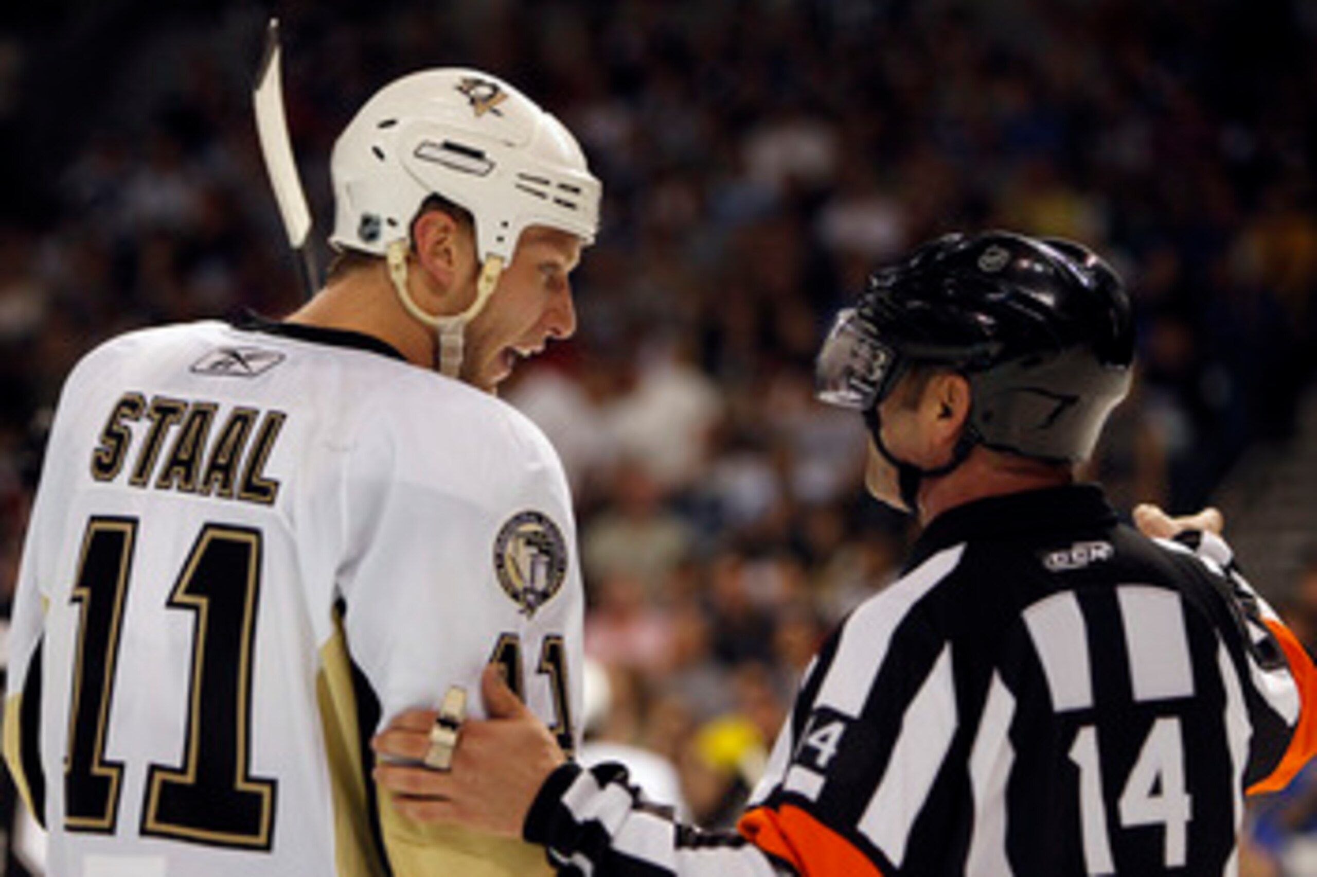 TAMPA, FL - APRIL 18: Jordan Staal #11 of the Pittsburgh Penguins chats with NHL Referee Dennis LaRue #14 during a break in the action against the Tampa Bay Lightning in Game Three of the Eastern Conference Quarterfinals during the 2011 NHL Stanley Cup Pl