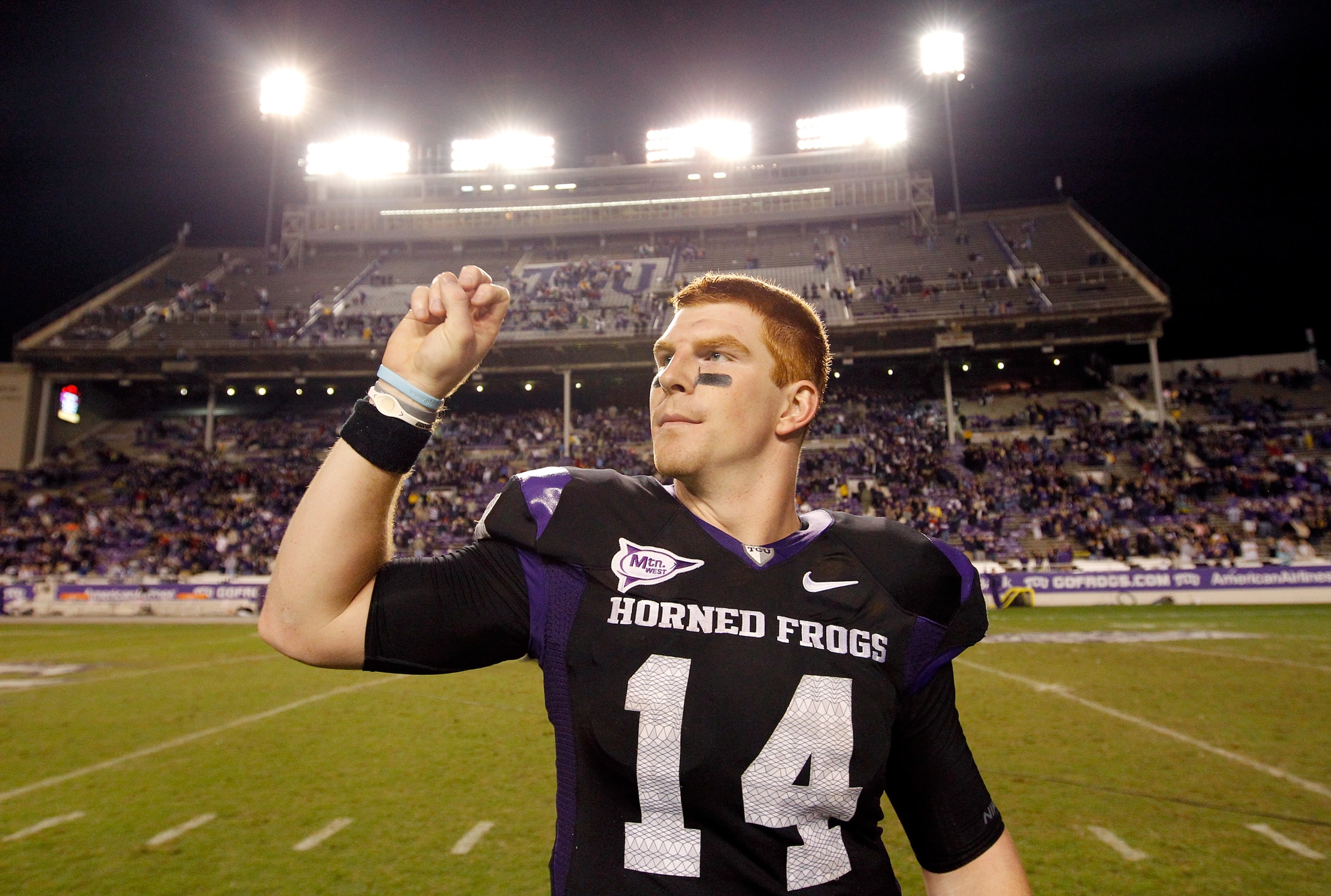 FORT WORTH, TX - OCTOBER 23:  Quarterback Andy Dalton #14 of the TCU Horned Frogs celebrates after TCU beat the Air Force Falcons 38-7 at Amon G. Carter Stadium on October 23, 2010 in Fort Worth, Texas.  (Photo by Tom Pennington/Getty Images)