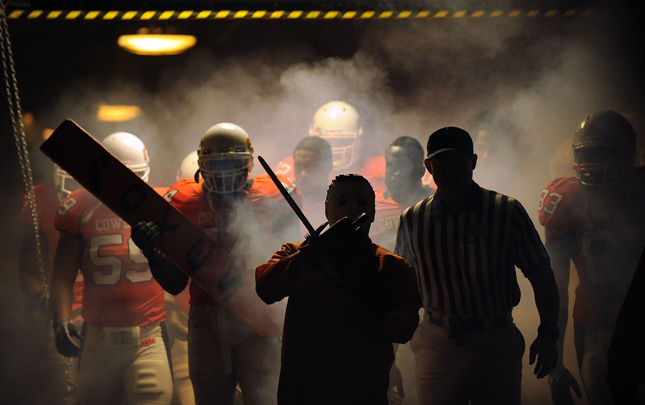 STILLWATER, OK - OCTOBER 31: The Oklahoma State Cowboys make their way through the tunnel before taking on the Texas Longhorns at Boone Pickens Stadium on October 31, 2009 in Stillwater, Oklahoma. (Photo by Ronald Martinez/Getty Images) STILLWATER, OK - OCTOBER 31: The Oklahoma State Cowboys make their way through the tunnel before taking on the Texas Longhorns at Boone Pickens Stadium on October 31, 2009 in Stillwater, Oklahoma. (Photo by Ronald Martinez/Getty Images)