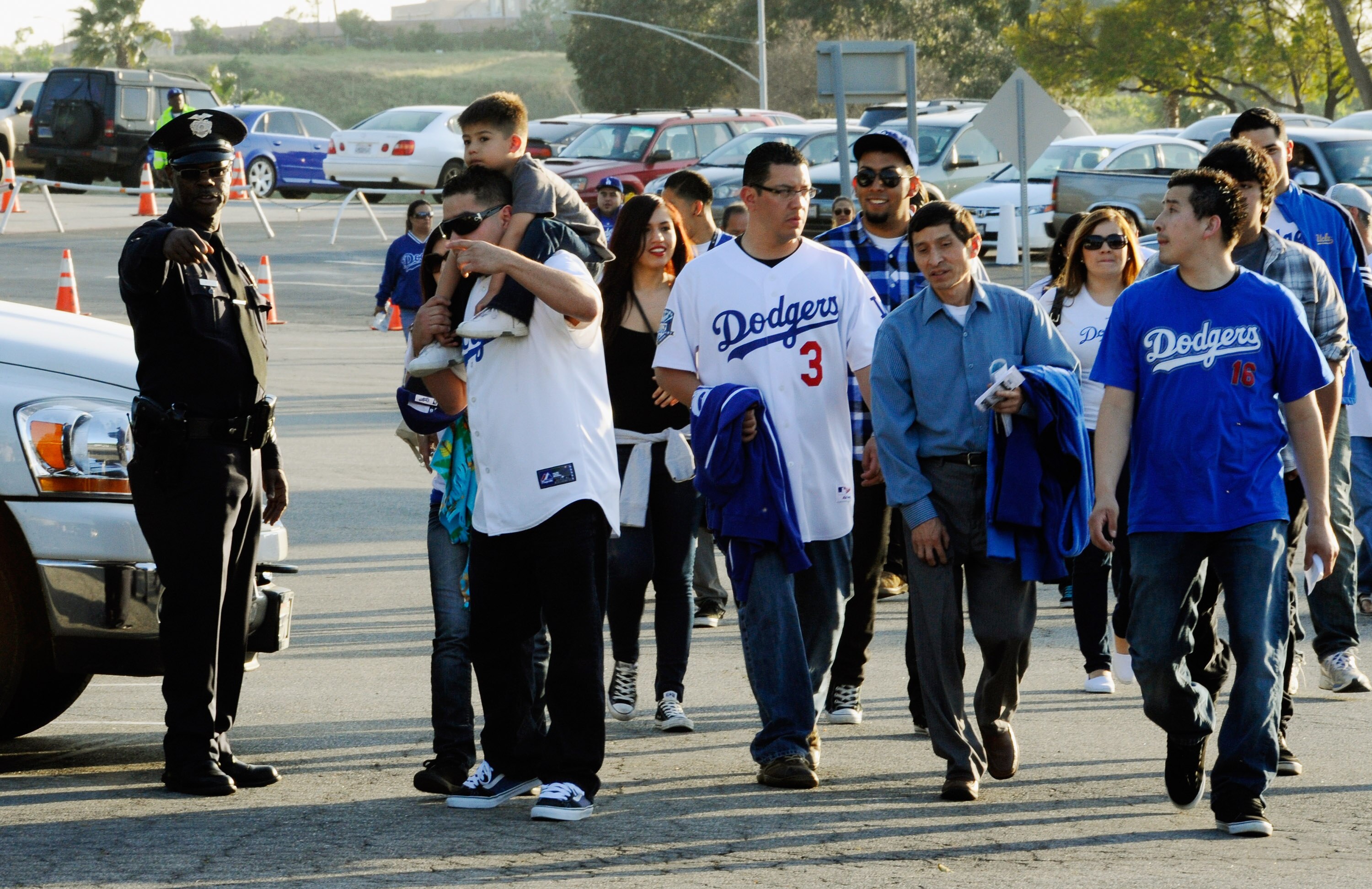 LOS ANGELES, CA - APRIL 14:  Los Angels Dodger fans ask for direction from a Los Angeles Police Department officer at Dodger Stadium prior to the start of the St. Louis Cardinals and Los Angeles Dodgers baseball game on April 14, 2011 in Los Angeles, Cali