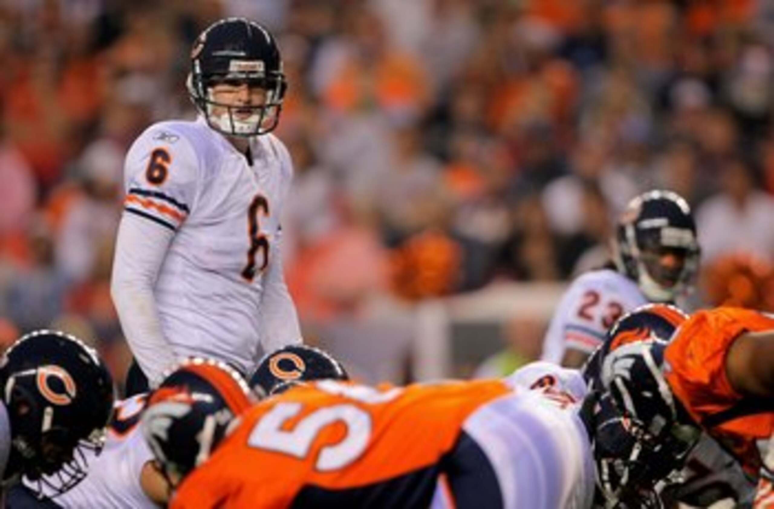 DENVER - AUGUST 30:  Quarterback Jay Cutler #6 of the Chicago Bears runs the offense against the Denver Broncos during preseason NFL action at INVESCO Field at Mile High on August 30, 2009 in Denver, Colorado. The Bears defeated the Broncos 27-17.  (Photo