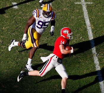 ATHENS, GA - OCTOBER 03:  Lazarius Levingston #95 of the Louisiana State University Tigers gives chase to quarterback Joe Cox #14 of the Georgia Bulldogs at Sanford Stadium on October 3, 2009 in Athens, Georgia. (Photo by Kevin C. Cox/Getty Images)