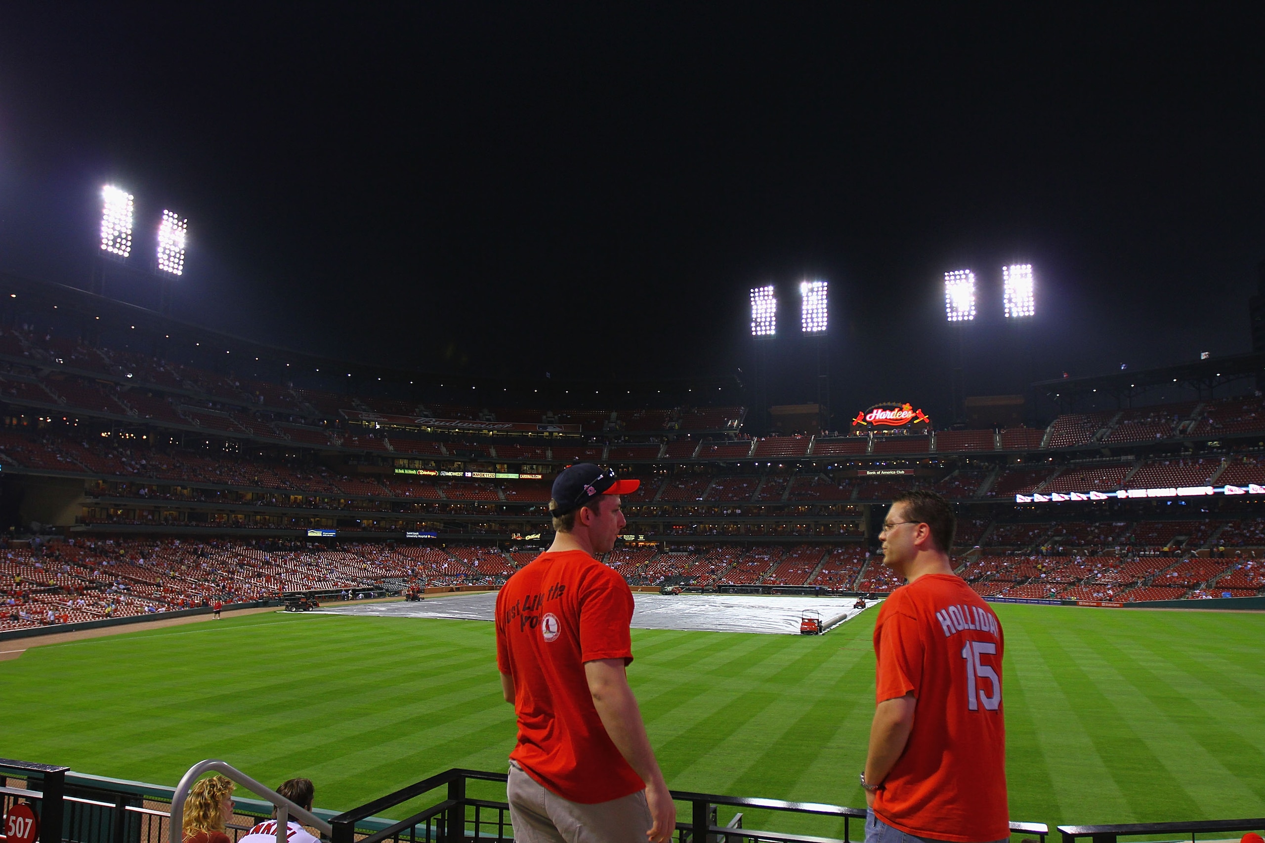 ST. LOUIS, MO - APRIL 19: Fans wait out a rain delay as a severe thunder storm moves in prior to the Washington Nationals playing the St. Louis Cardinals at Busch Stadium on April 19, 2011 in St. Louis, Missouri.  (Photo by Dilip Vishwanat/Getty Images)