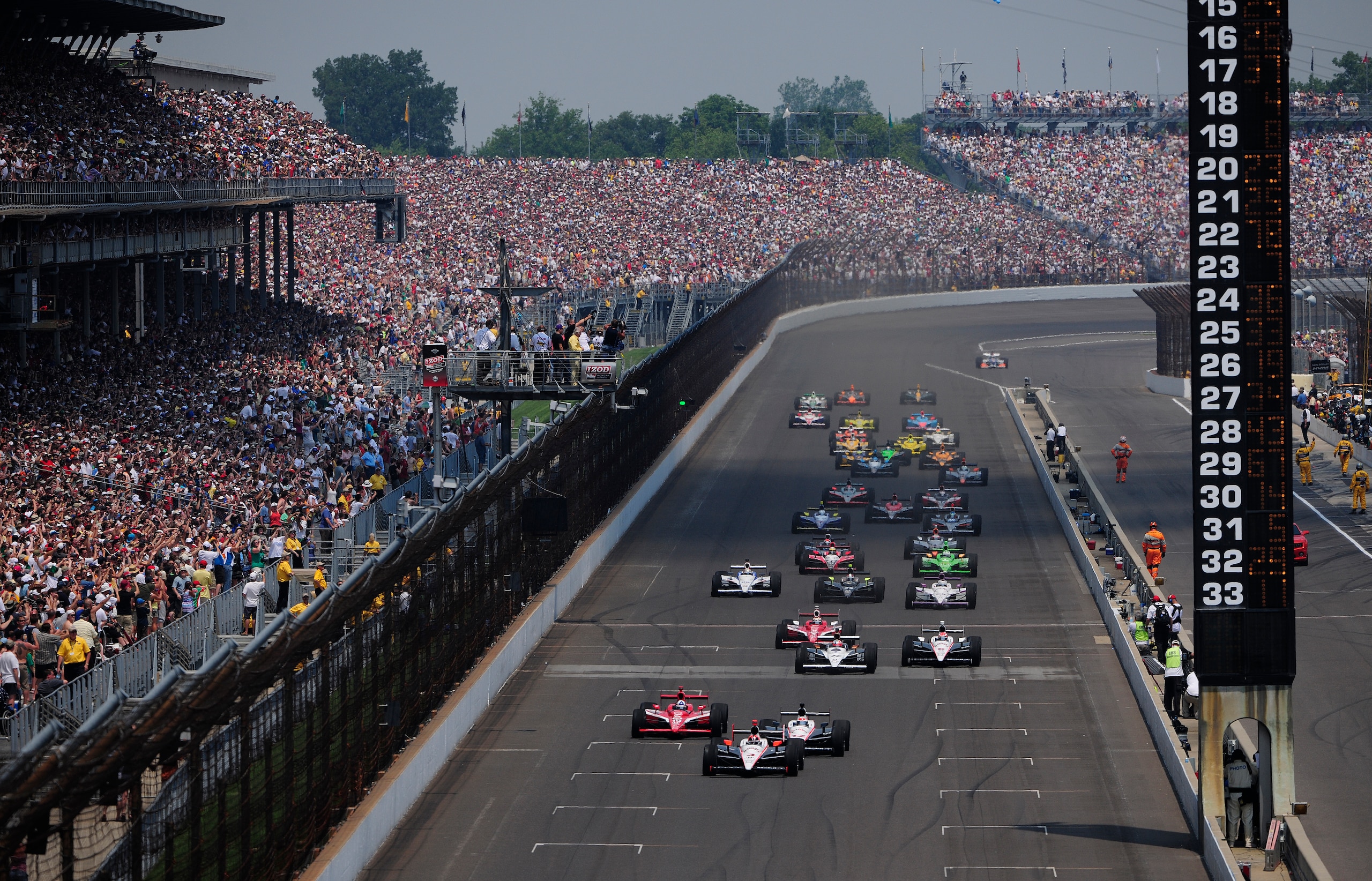 INDIANAPOLIS - MAY 30: Helio Castroneves of Brazil, driver of the #3 Team Penske Dallara Honda, leads the field at the start of the IZOD IndyCar Series 94th running of the Indianapolis 500 at the Indianapolis Motor Speedway on May 30, 2010 in Indianapoli INDIANAPOLIS - MAY 30: Helio Castroneves of Brazil, driver of the #3 Team Penske Dallara Honda, leads the field at the start of the IZOD IndyCar Series 94th running of the Indianapolis 500 at the Indianapolis Motor Speedway on May 30, 2010 in Indianapoli