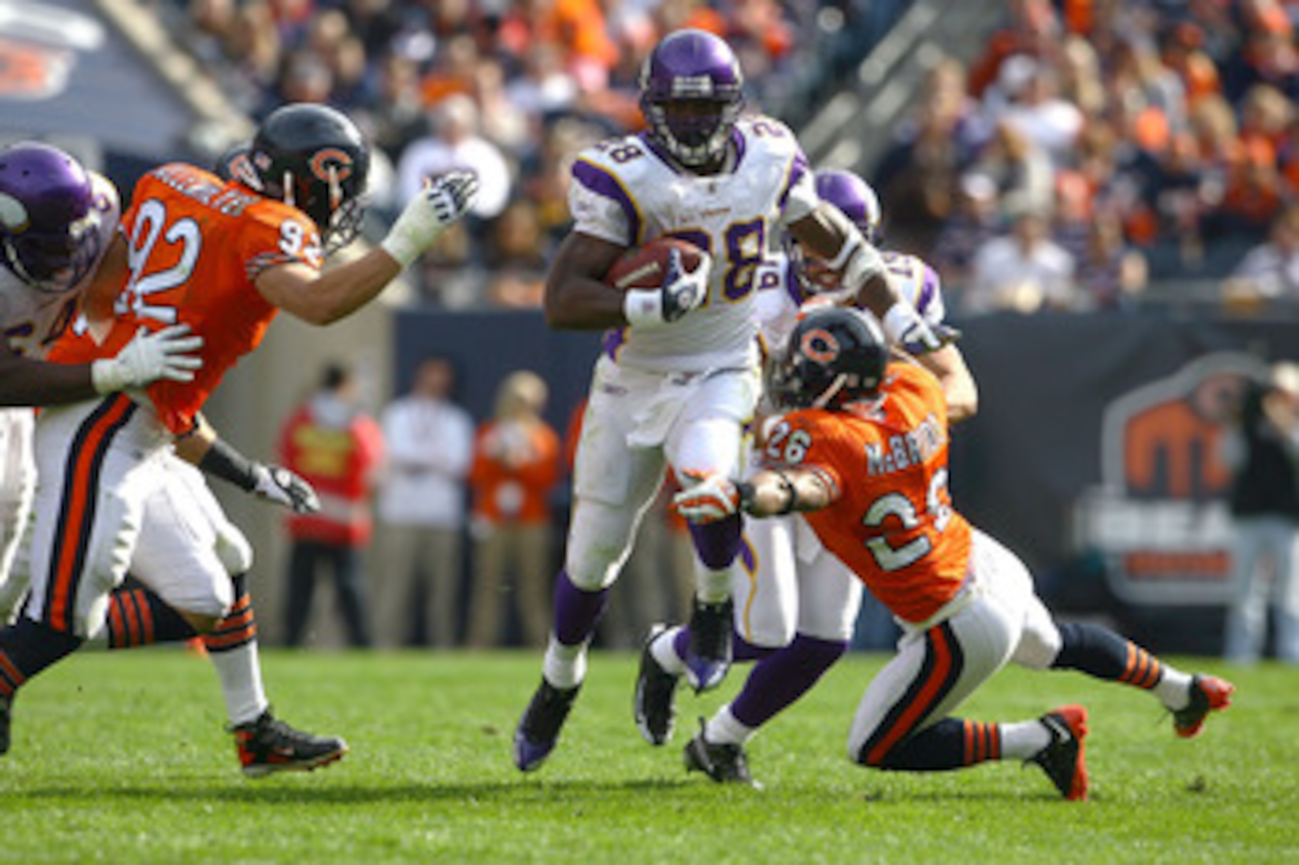 CHICAGO - OCTOBER 19:  Adrian Peterson #28 of the Minnesota Vikings runs for a 54-yard touchdown in the third quarter against the Chicago Bears at Soldier Field on October 19, 2008 in Chicago, Illinois.  (Photo by Jeff Gross/Getty Images)
