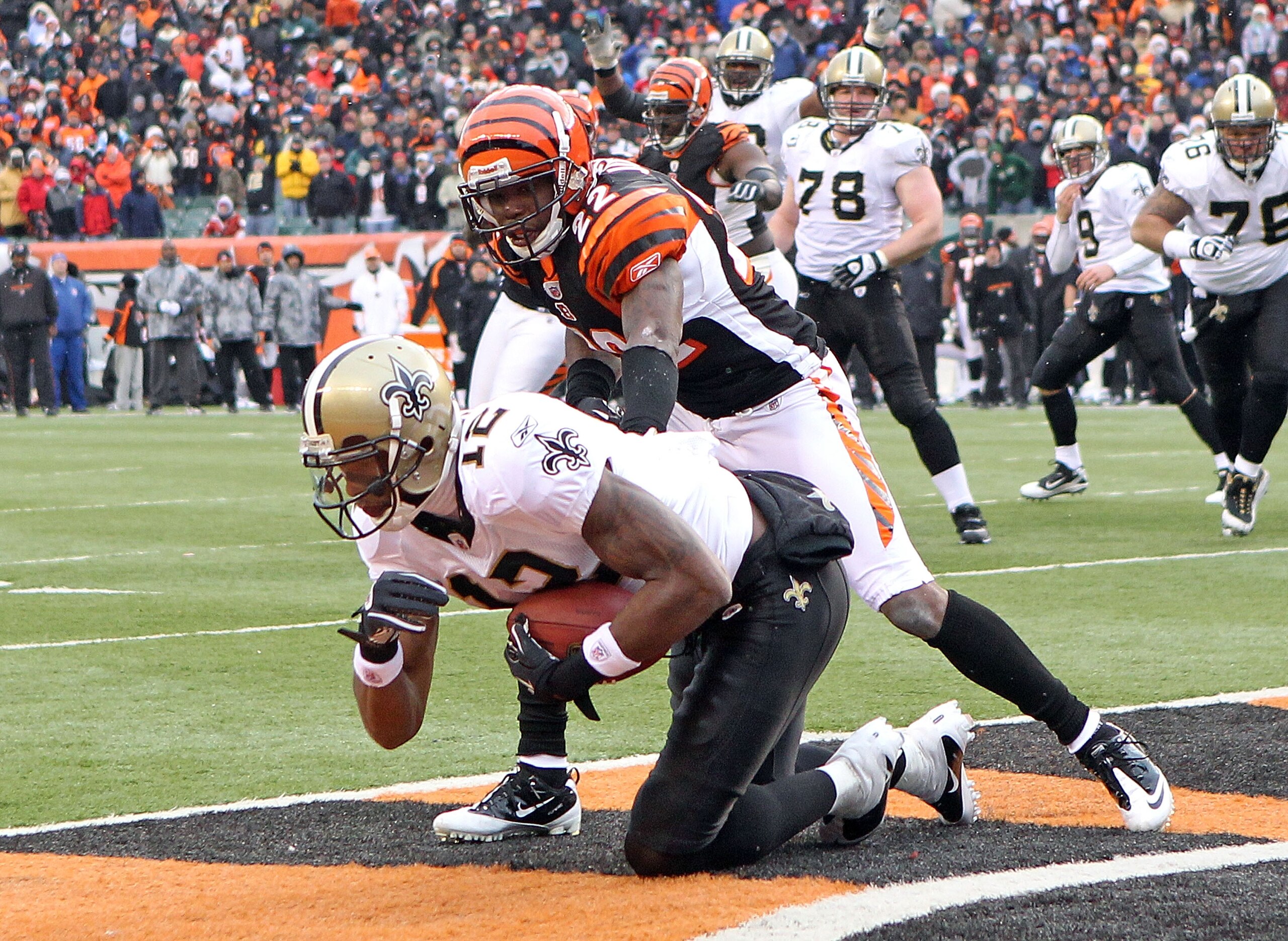 CINCINNATI, OH - DECEMBER 05: Marques Colston#12 of the New Orleans Saints catches the game winning touchdown in front of Johnathan Joseph #22 of the Cincinnati Bengals during the NFL game at Paul Brown Stadium on December 5, 2010 in Cincinnati, Ohio.  Th