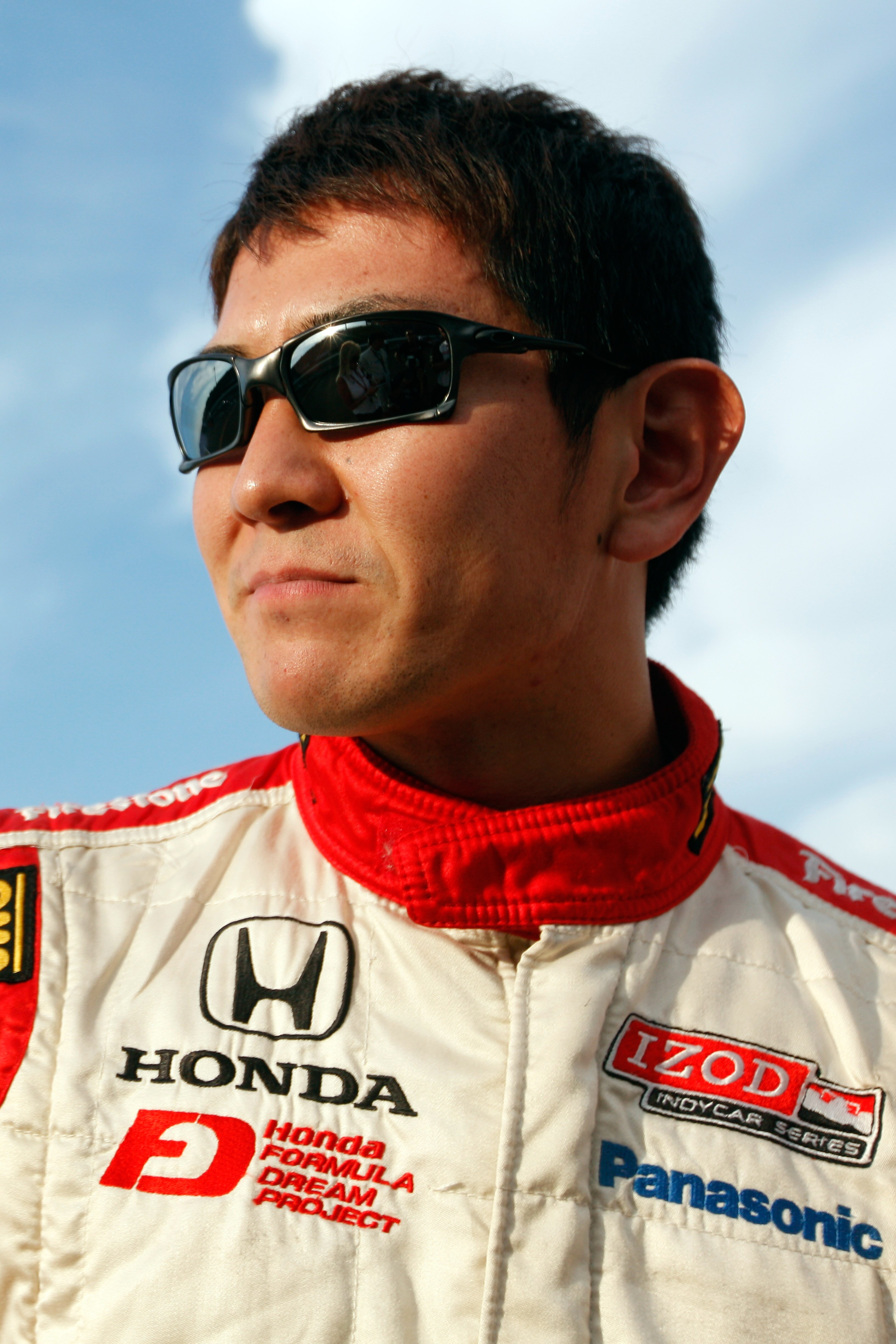 MOTEGI, JAPAN - SEPTEMBER 18:  Hideki Mutoh of Japan, driver of the #06 Formula Dream/Panasonic Dallara Honda talks with the media after qualifying for the IndyCar Series Indy Japan 300 on September 18, 2010 in Motegi, Japan.  (Photo by Chris Graythen/Get