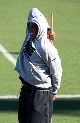 SAN DIEGO, CA - FEBRUARY 10: 2010 Heisman Trophy winning quarterback Cam Newton of Auburn stretches before his workout routine for the media at Cathedral High School's sports stadium on February 10, 2011 in San Diego, California. (Photo by Kent Horner/ Ge