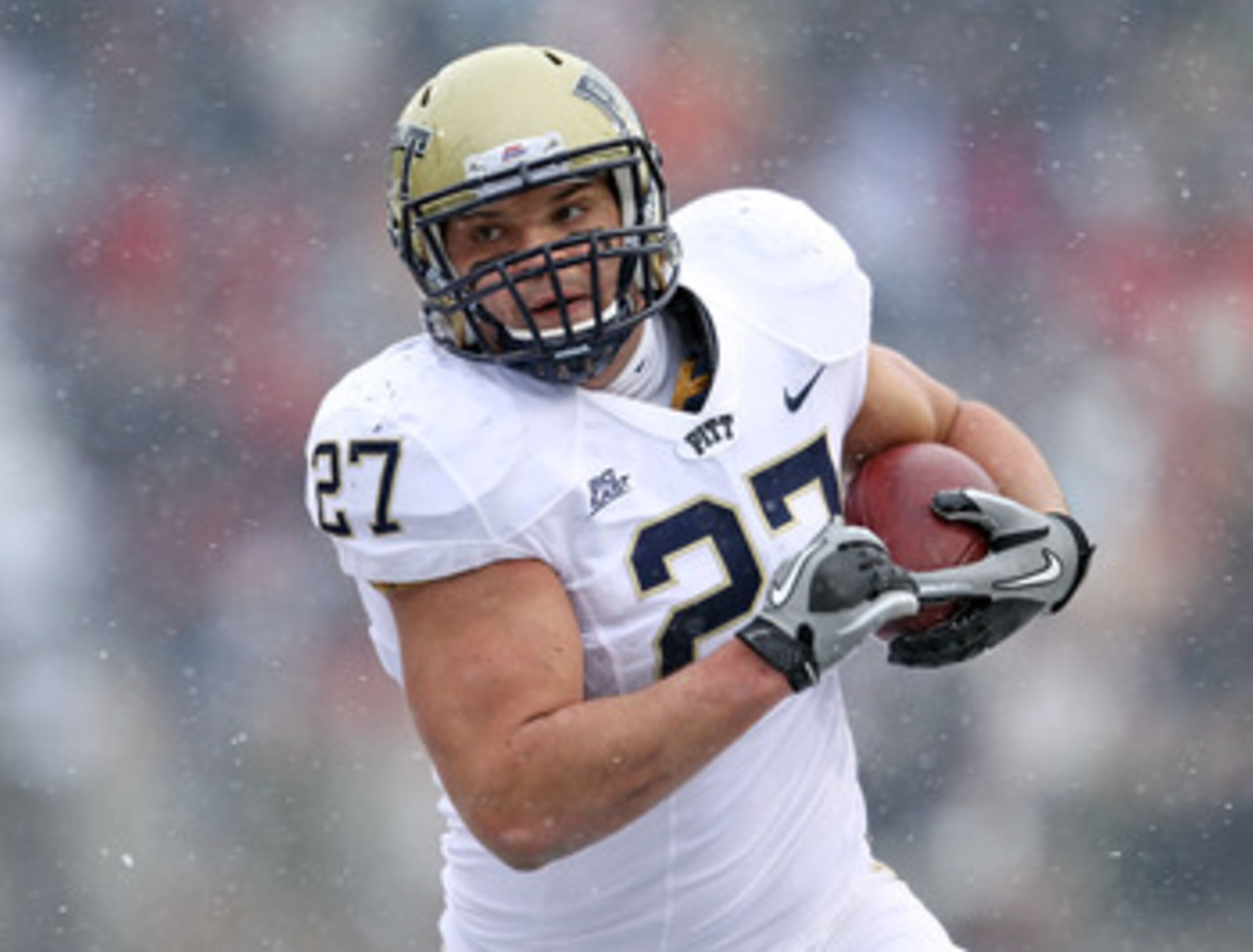 CINCINNATI, OH - DECEMBER 04:  Henry Hynoski #27 of the Pittsburgh Panthers runs with the ball during the Big East Conference game against the Cincinnati Bearcats at Nippert Stadium on December 4, 2010 in Cincinnati, Ohio.  Pittsburgh won 28-10.  (Photo b