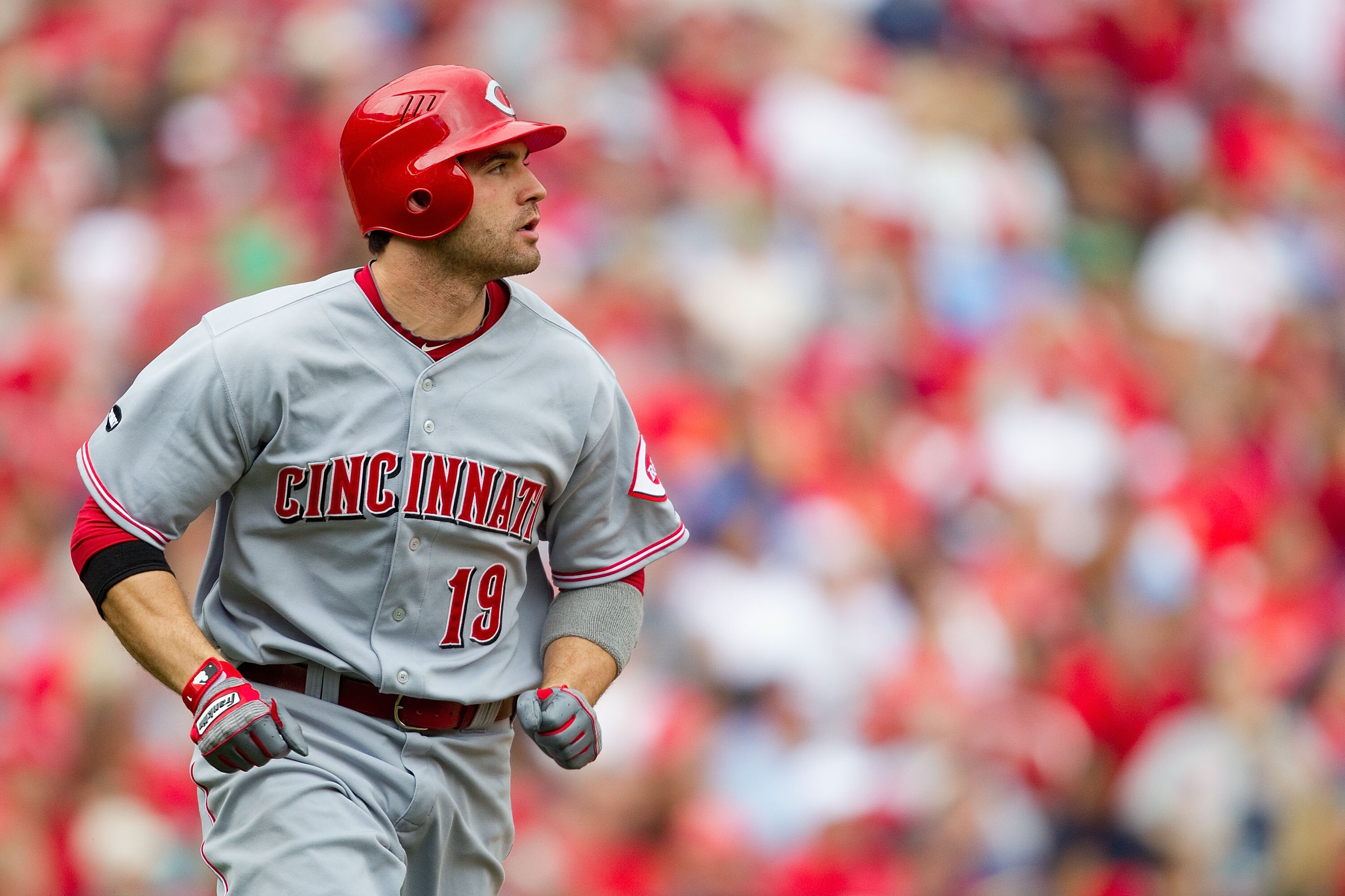 ST. LOUIS, MO - APRIL 23: Joey Votto #19 of the Cincinnati Reds watches his two-run home run leave the park against the St. Louis Cardinals at Busch Stadium on April 23, 2011 in St. Louis, Missouri.  (Photo by Dilip Vishwanat/Getty Images)