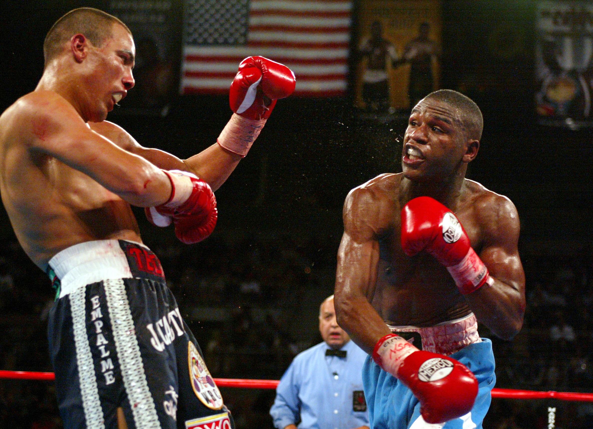 LAS VEGAS, NV - DECEMBER 7:  Floyd Mayweather lands a right hook to Jose Luis Castillo of Mexico during Mayweather's unanimous Decision (115-113, 116-113, 115-113) over Castillo during their WBC Lightweight Title fight at the Mandalay Bay Events Center on
