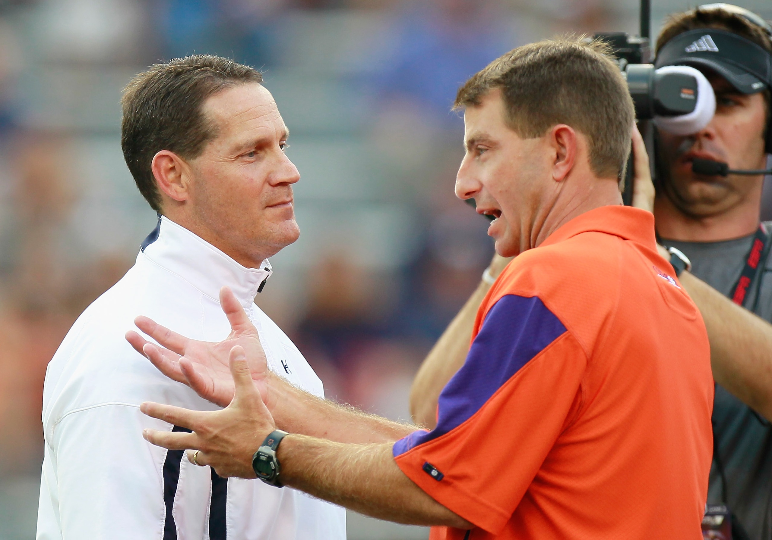 AUBURN, AL - SEPTEMBER 18: Head coach Dabo Swinney of the Clemson Tigers and head coach Gene Chizik of the Auburn Tigers during pregame at Jordan-Hare Stadium on September 18, 2010 in Auburn, Alabama. (Photo by Kevin C. Cox/Getty Images) AUBURN, AL - SEPTEMBER 18: Head coach Dabo Swinney of the Clemson Tigers and head coach Gene Chizik of the Auburn Tigers during pregame at Jordan-Hare Stadium on September 18, 2010 in Auburn, Alabama. (Photo by Kevin C. Cox/Getty Images)