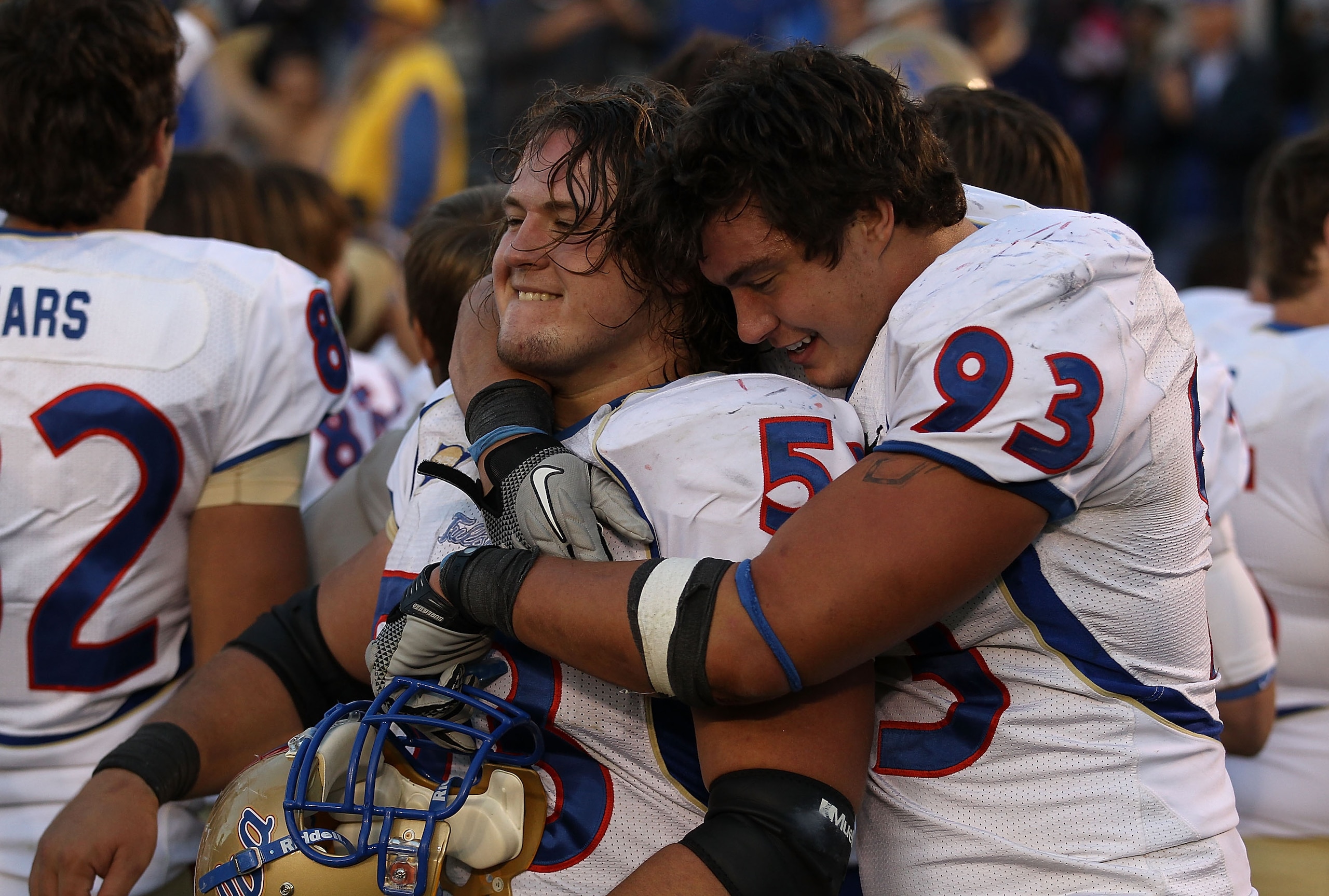 SOUTH BEND, IN - OCTOBER 30: Cory Dorris #93 of the Tulsa Golden Hurricane hugs teammate Trent Dupy #53 after a win over the Notre Dame Fighting Irish at Notre Dame Stadium on October 30, 2010 in South Bend, Indiana. Tulsa defeated Notre Dame 28-27. (Phot SOUTH BEND, IN - OCTOBER 30: Cory Dorris #93 of the Tulsa Golden Hurricane hugs teammate Trent Dupy #53 after a win over the Notre Dame Fighting Irish at Notre Dame Stadium on October 30, 2010 in South Bend, Indiana. Tulsa defeated Notre Dame 28-27. (Phot