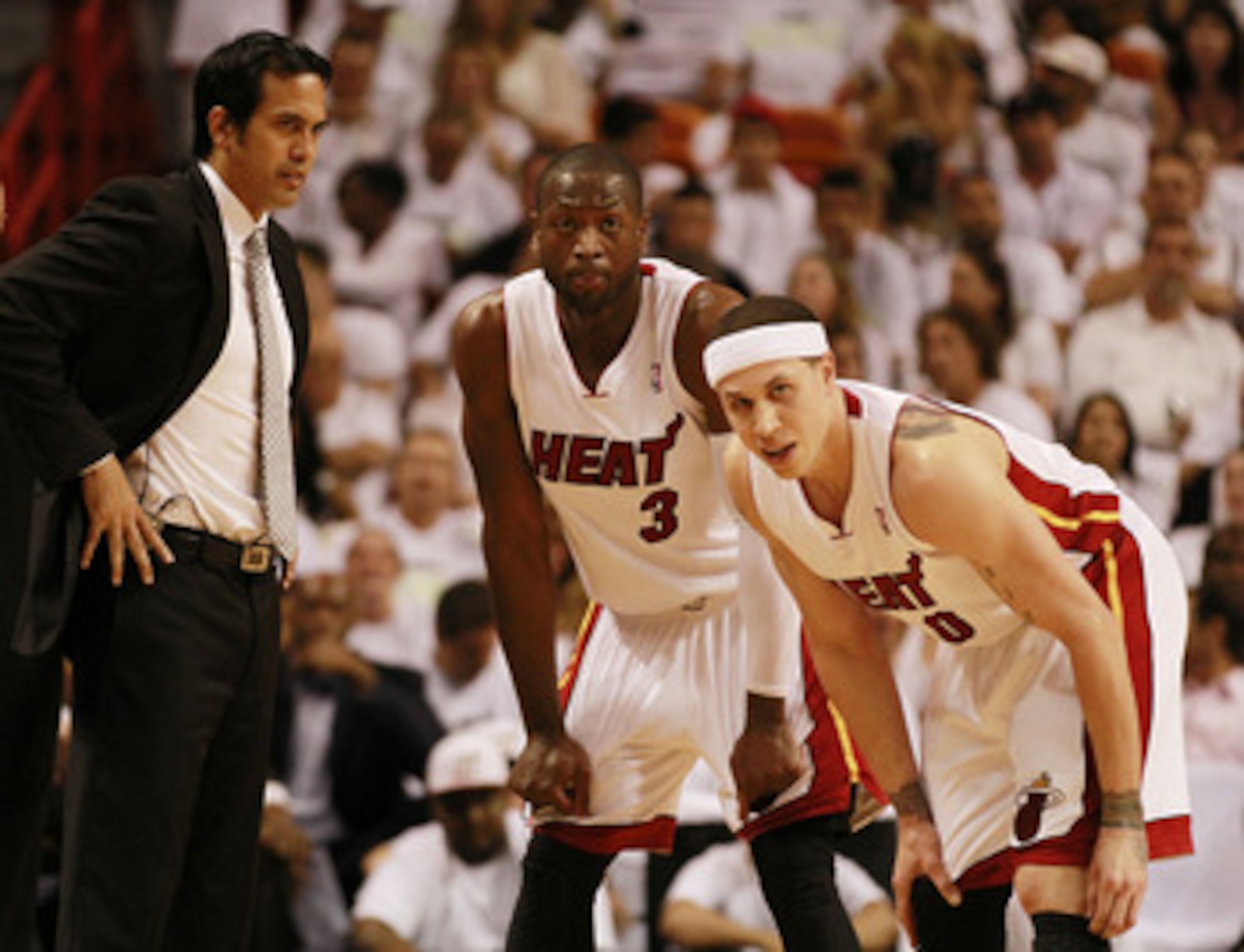 MIAMI, FL - APRIL 16:  Head Coach Erik Spoelstra, Guard Mike Bibby and Dwyane Wade #3 against the Philadelphia 76ers at the American Airlines Arena in Game One of the Eastern Conference Quarterfinals in the 2011 NBA Playoffs on April 16, 2011 in Miami, Fl