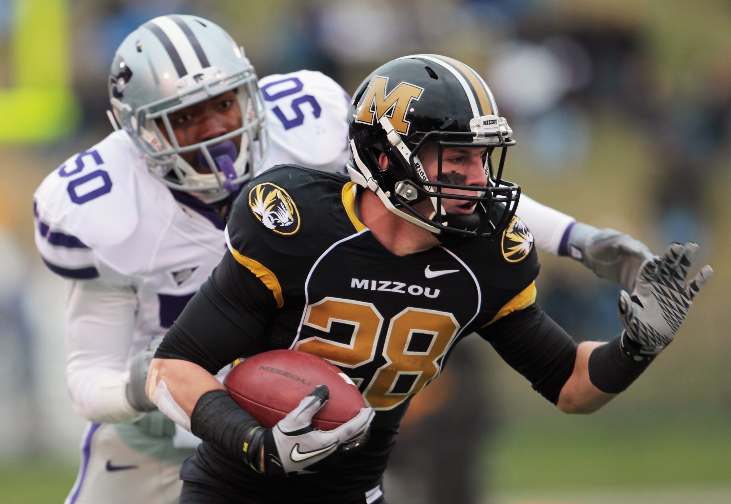 COLUMBIA, MO - NOVEMBER 13: Receiver T.J. Moe #28 of the Missouri Tigers carries the ball as Tre Walker #50 of the Kansas State Wildcats defends during the game on November 13, 2010 at Faurot Field/Memorial Stadium in Columbia, Missouri. (Photo by Jamie COLUMBIA, MO - NOVEMBER 13: Receiver T.J. Moe #28 of the Missouri Tigers carries the ball as Tre Walker #50 of the Kansas State Wildcats defends during the game on November 13, 2010 at Faurot Field/Memorial Stadium in Columbia, Missouri. (Photo by Jamie
