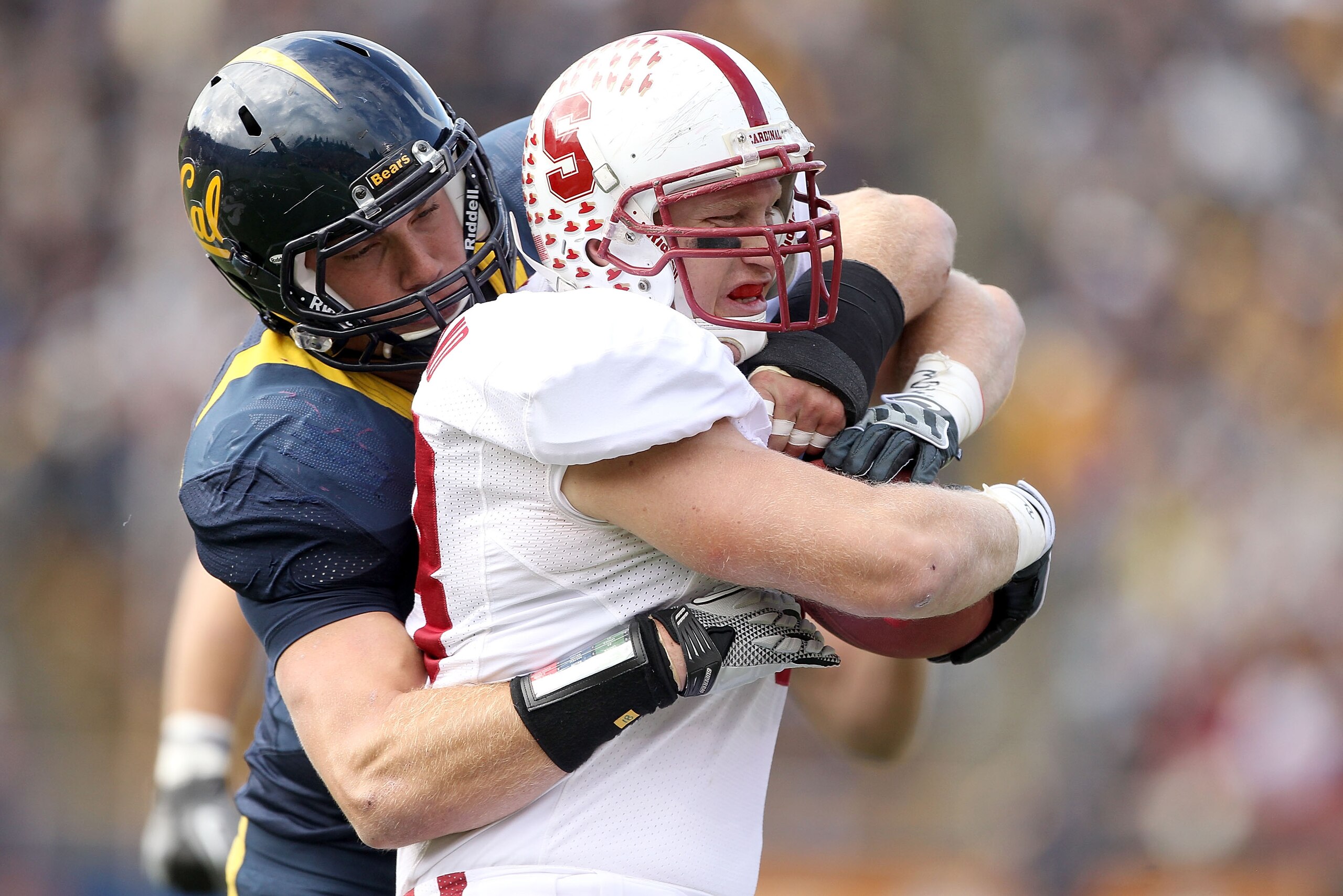 BERKELEY, CA - NOVEMBER 20:  Konrad Reuland #88 of the Stanford Cardinal is tackled by Mike Mohamed #18 of the California Golden Bears at California Memorial Stadium on November 20, 2010 in Berkeley, California.  (Photo by Ezra Shaw/Getty Images)