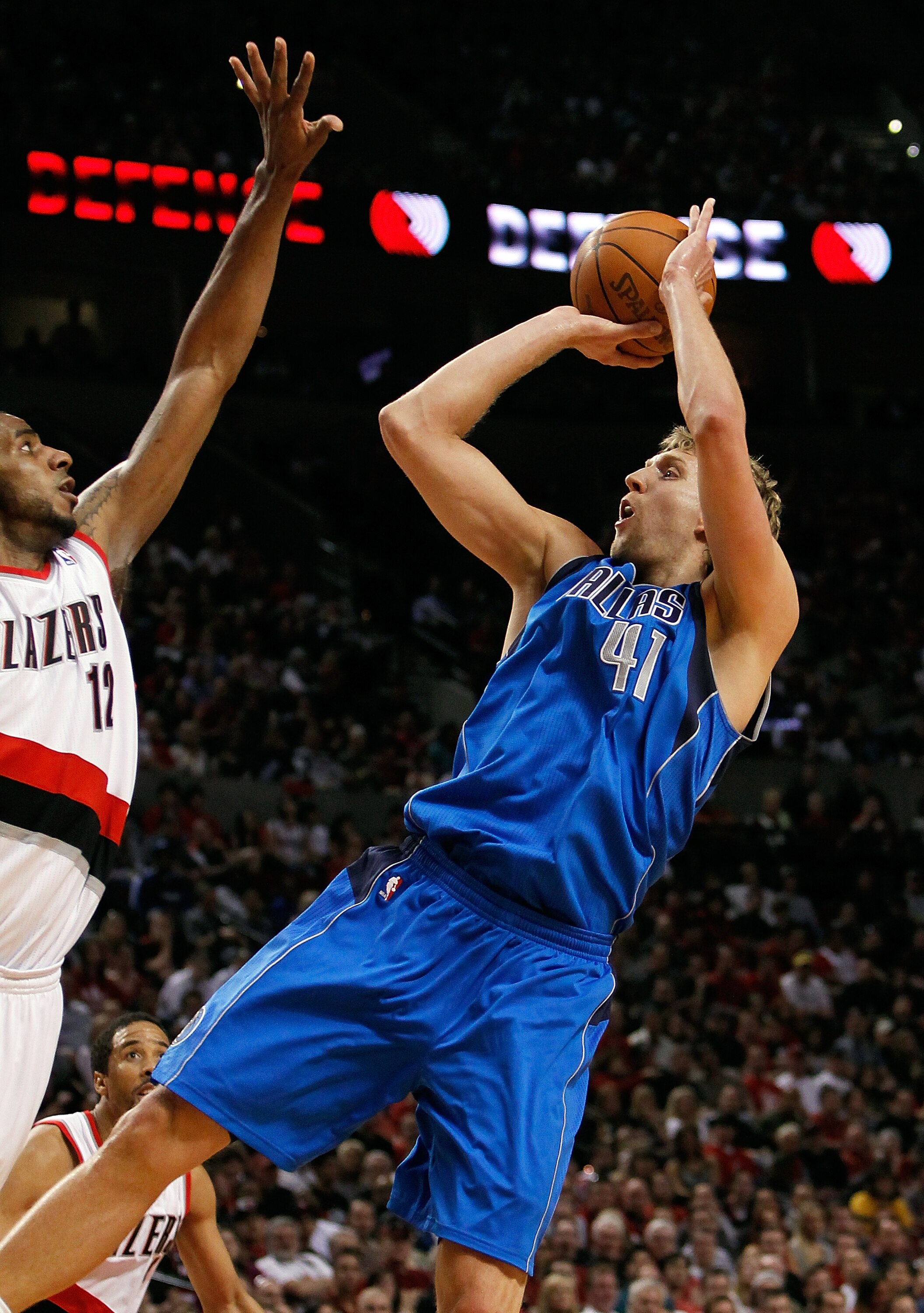 PORTLAND, OR - APRIL 23:  LaMarcus Aldrdige #12 of the Portland Trail Blazers defends Dirk Nowitzki #41 of the Dallas Mavericks in Game Four of the Western Conference Quarterfinals in the 2011 NBA Playoffs on April 23, 2011 at the Rose Garden in Portland,