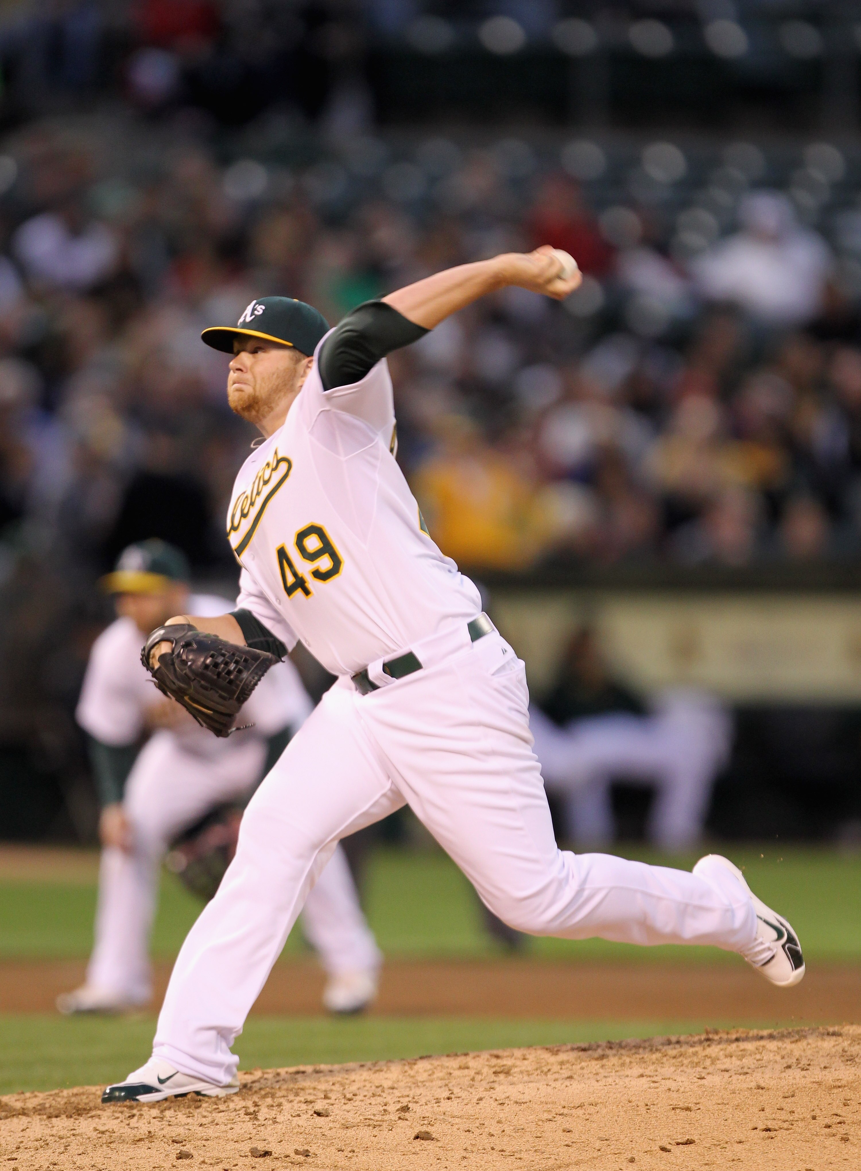 OAKLAND, CA - APRIL 19:  Brett Anderson #49 of the Oakland Athletics in action against the Boston Red Sox at Oakland-Alameda County Coliseum on April 19, 2011 in Oakland, California.  (Photo by Ezra Shaw/Getty Images)