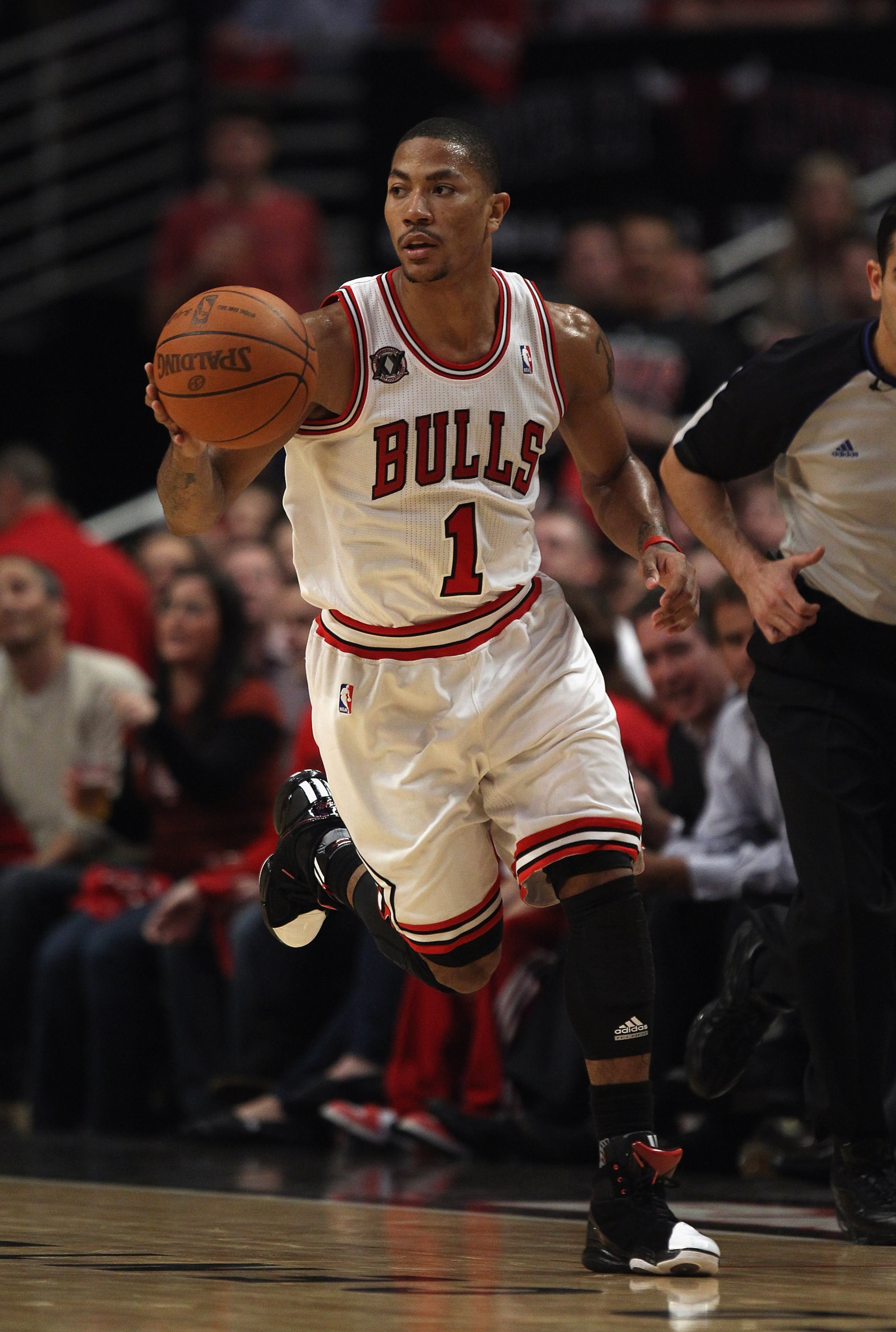 CHICAGO, IL - APRIL 26: Derrick Rose #1 of the Chicago Bulls moves up the court against the Indiana Pacers in Game Five of the Eastern Conference Quarterfinals in the 2011 NBA Playoffs at the United Center on April 26, 2011 in Chicago, Illinois. The Bulls CHICAGO, IL - APRIL 26: Derrick Rose #1 of the Chicago Bulls moves up the court against the Indiana Pacers in Game Five of the Eastern Conference Quarterfinals in the 2011 NBA Playoffs at the United Center on April 26, 2011 in Chicago, Illinois. The Bulls