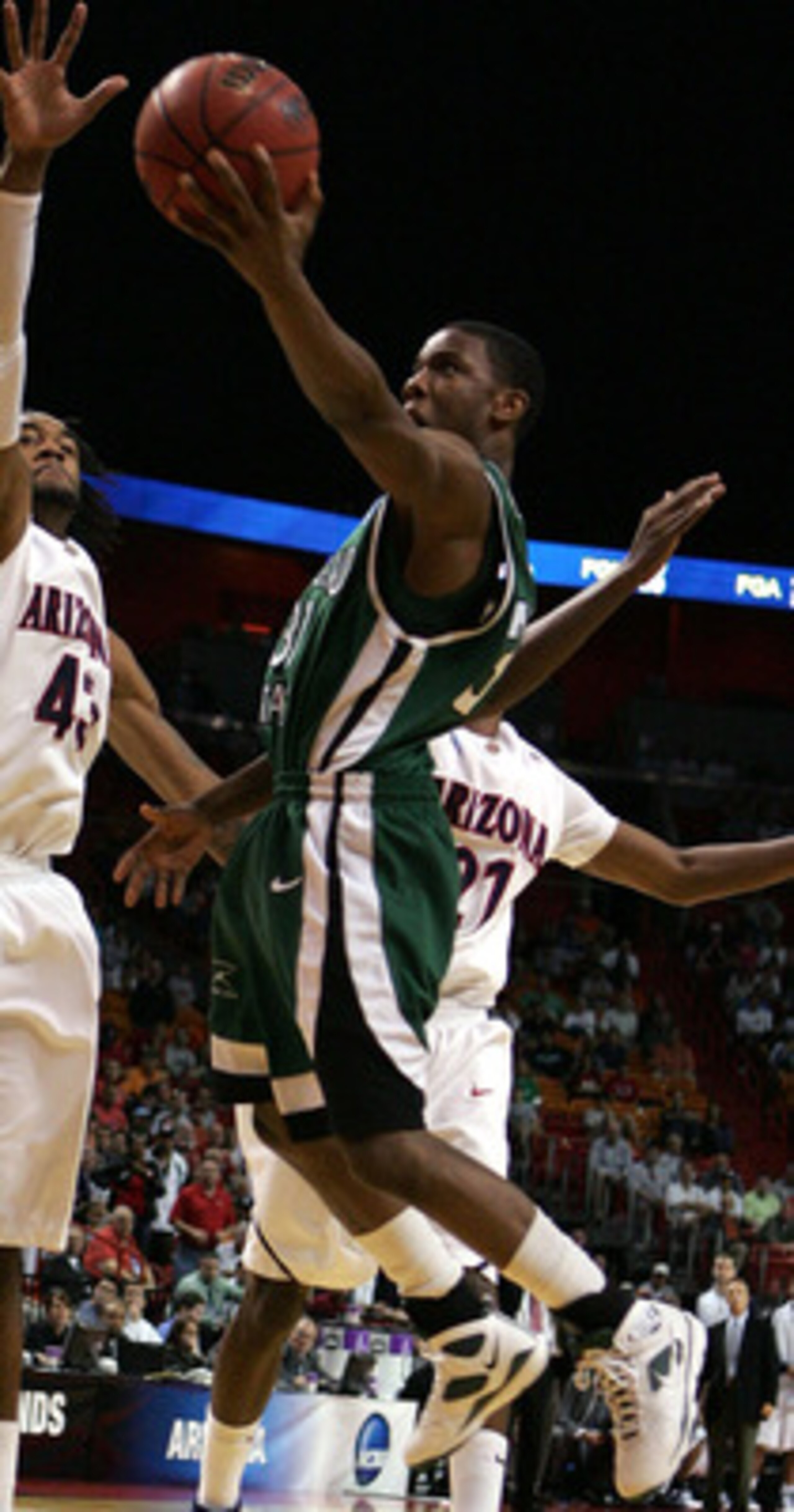 MIAMI - MARCH 22:  Forward Jordan Hill #43 of the  University of Arizona Wildcats blocks the shot of guard Norris Cole #30 of the Cleveland State University Vikings during the second round of the NCAA Division I Men's Basketball Tournament at the American