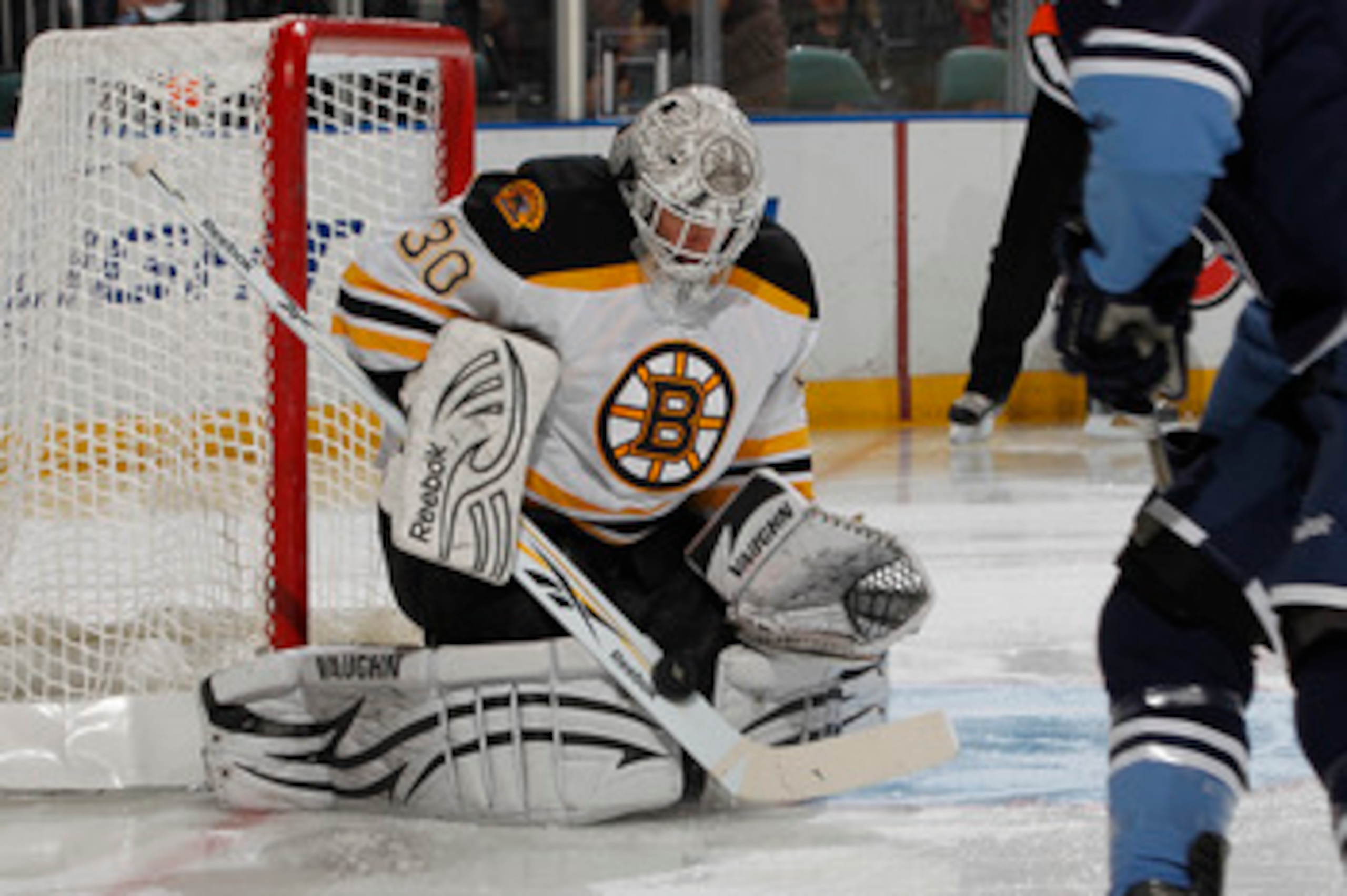 SUNRISE, FL - DECEMBER 27: Goaltender Tim Thomas #30 of the Boston Bruins stops a shot by Michael Santorelli #13 of the Florida Panthers  on December 27, 2010 at the BankAtlantic Center in Sunrise, Florida. The Bruins defeated the Panthers 3-2 in a shoot-