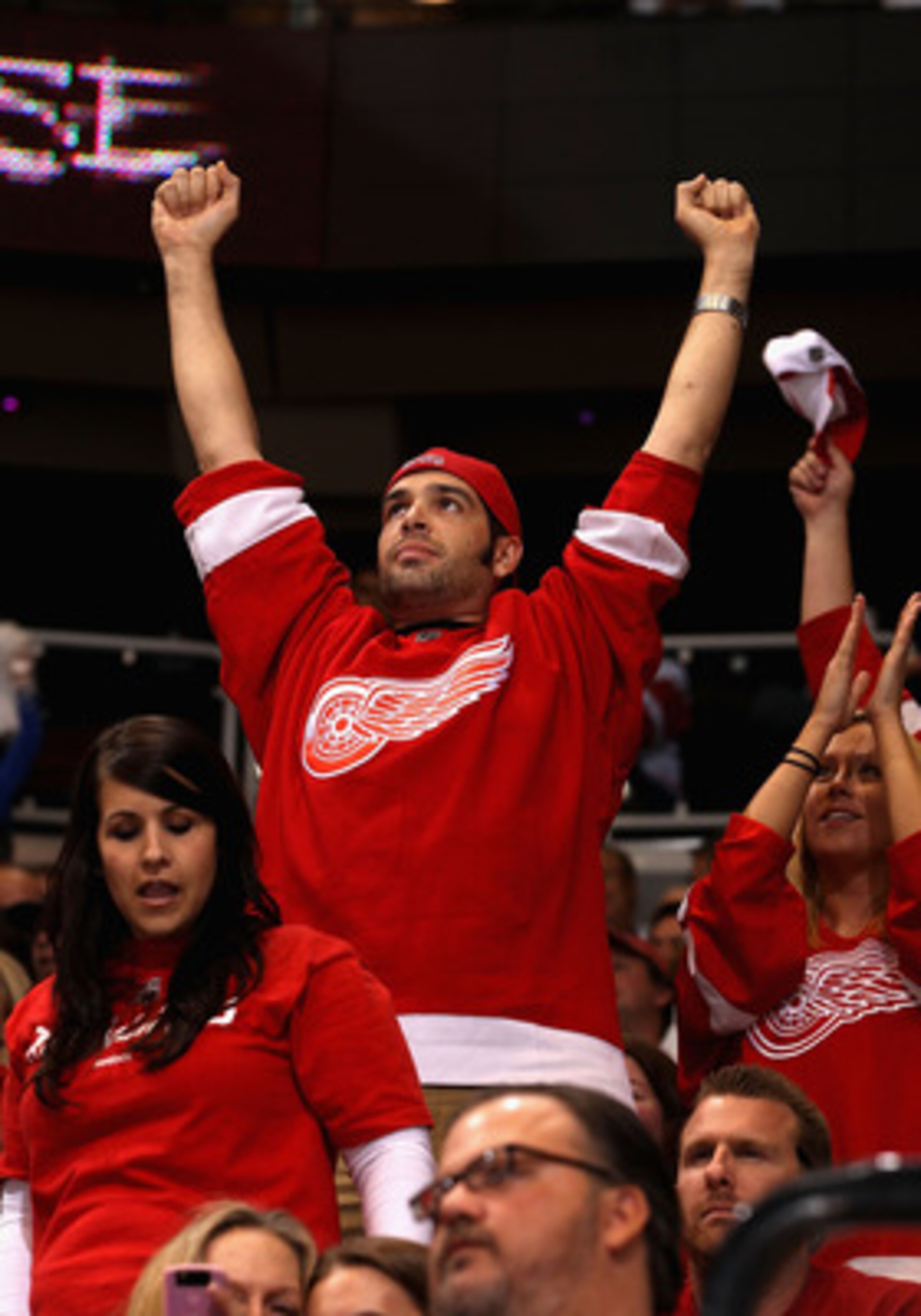 GLENDALE, AZ - APRIL 20:  Fans of the Detroit Red Wings celebrate in the final moments of Game Four of the Western Conference Quarterfinals against the Phoenix Coyotes during the 2011 NHL Stanley Cup Playoffs at Jobing.com Arena on April 20, 2011 in Glend