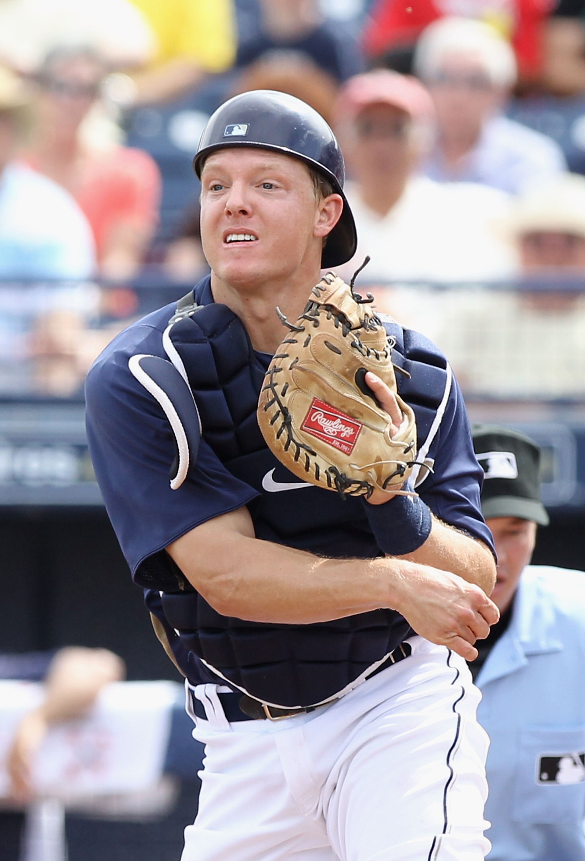 PEORIA, AZ - MARCH 15:  Catcher Nick Hundley #4 of the San Diego Padres throws to third base against the Los Angeles Angels of Anaheim during the spring training game at Peoria Stadium on March 15, 2011 in Peoria, Arizona.  (Photo by Christian Petersen/Ge