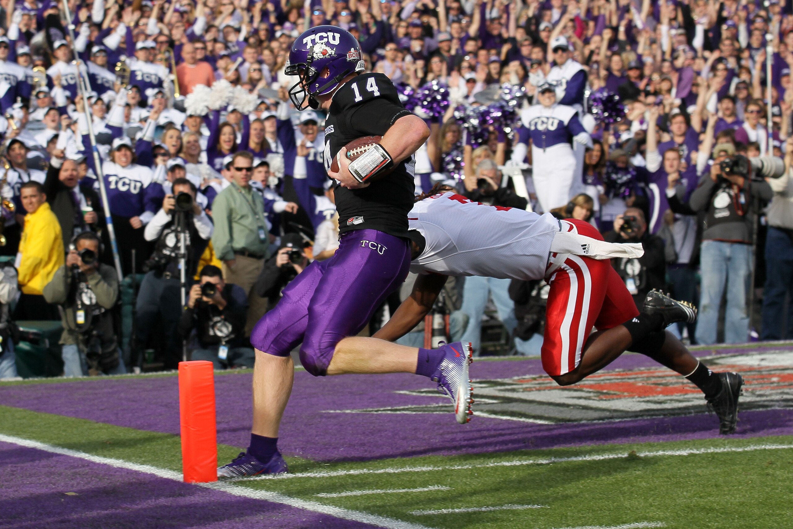 PASADENA, CA - JANUARY 01: Quarterback Andy Dalton #14 of the TCU Horned Frogs scores a touchdown against the Wisconsin Badgers in the first quarter of the 97th Rose Bowl game on January 1, 2011 in Pasadena, California. (Photo by Stephen Dunn/Getty Imag PASADENA, CA - JANUARY 01: Quarterback Andy Dalton #14 of the TCU Horned Frogs scores a touchdown against the Wisconsin Badgers in the first quarter of the 97th Rose Bowl game on January 1, 2011 in Pasadena, California. (Photo by Stephen Dunn/Getty Imag