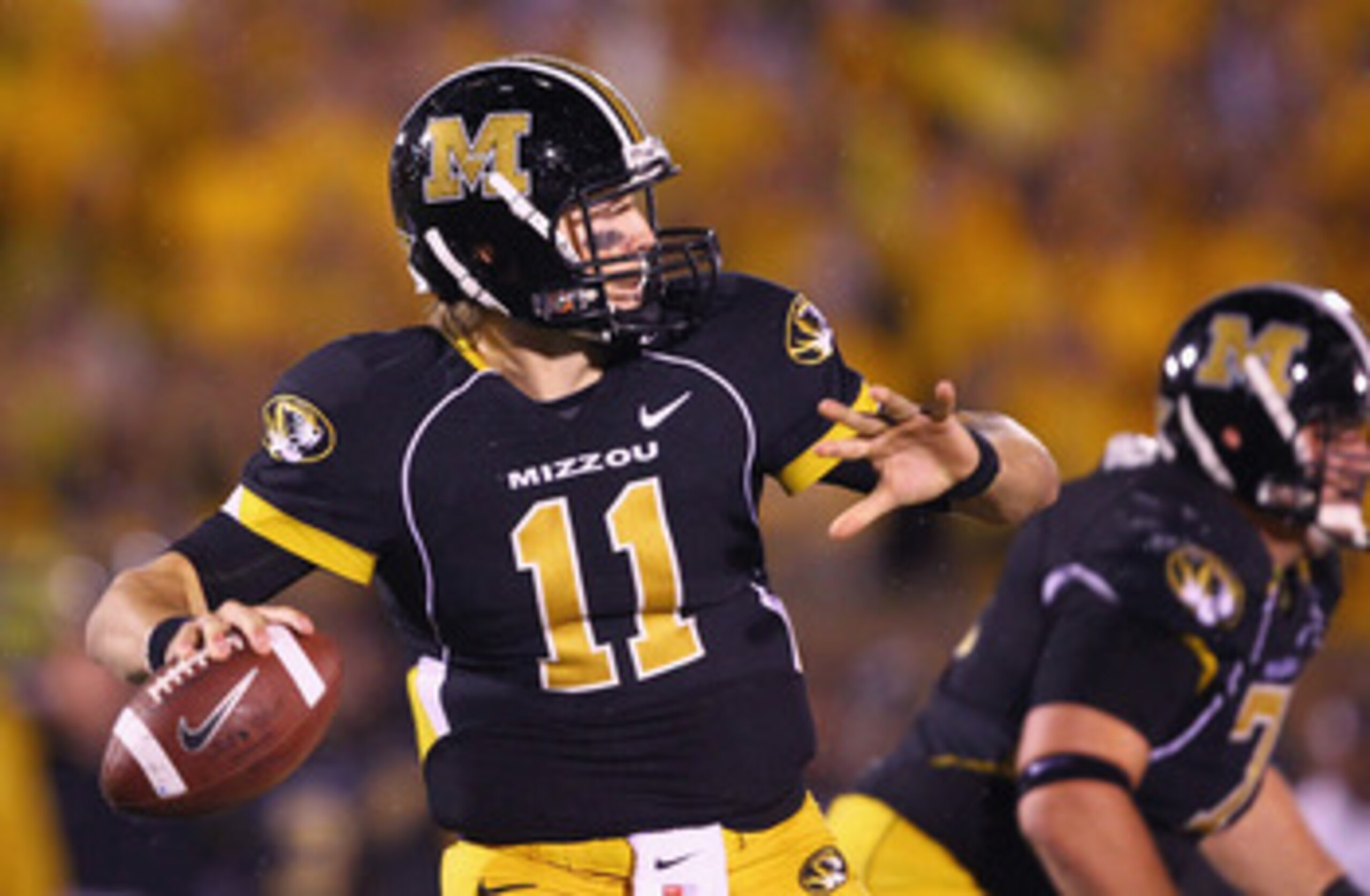 COLUMBIA, MISSOURI - OCTOBER 23: Blaine Gabbert #11 of the Missouri Tigers passes against the Oklahoma Sooners at Faurot Field/Memorial Stadium on October 23, 2010 in Columbia, Missouri.  The Tigers beat the Sooners 36-27.  (Photo by Dilip Vishwanat/Getty