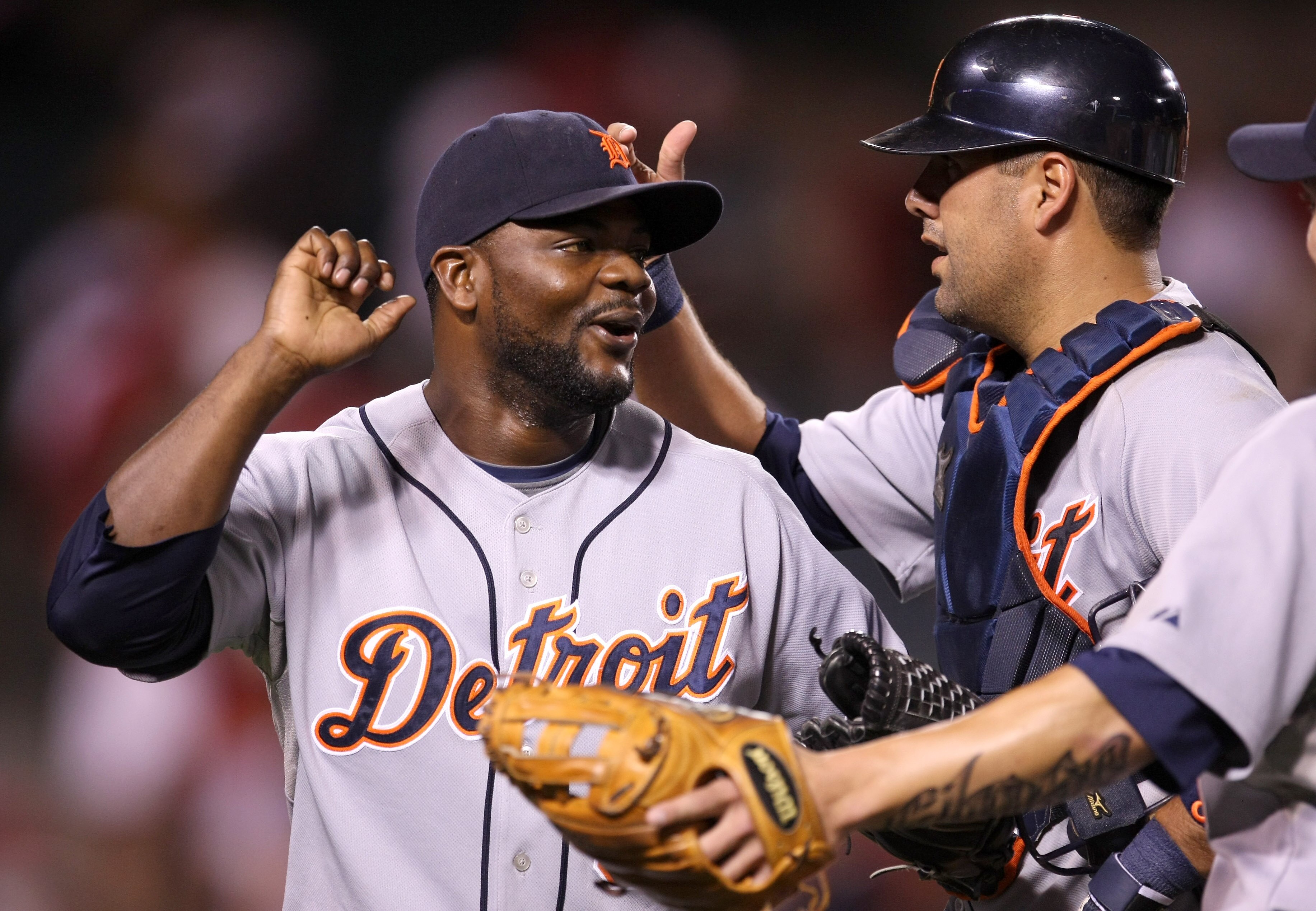 ANAHEIM, CA - AUGUST 24:  Closer Fernanado Rodney #56 and catcher Gerald Laird #8 of the Detroit Tigers celebrate after the game against the Los Angeles Angels of Anaheim on August 24, 2009 at Angel Stadium in Anaheim, California.  Rodney picked up his 27