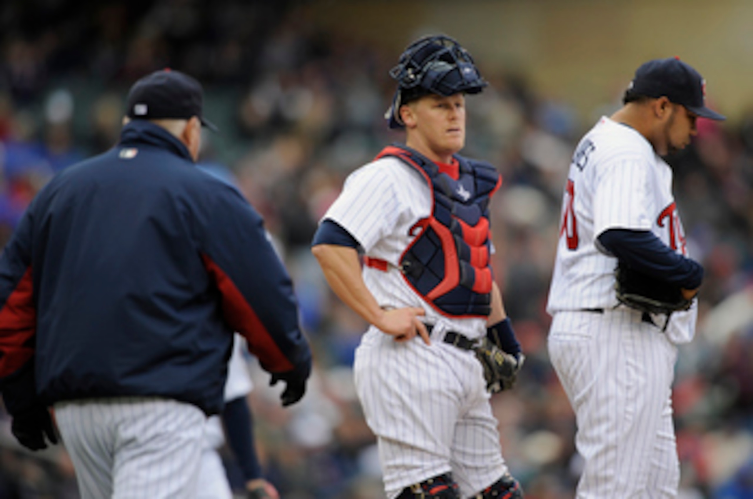 MINNEAPOLIS, MN - APRIL 28: Manager Ron Gardenhire #35 walks out to the mound to reliever pitcher Jose Mijares #50 of the Minnesota Twins while catcher Steve Holm #27 looks on during in the seventh inning of their game against the Tampa Bay Rays on April
