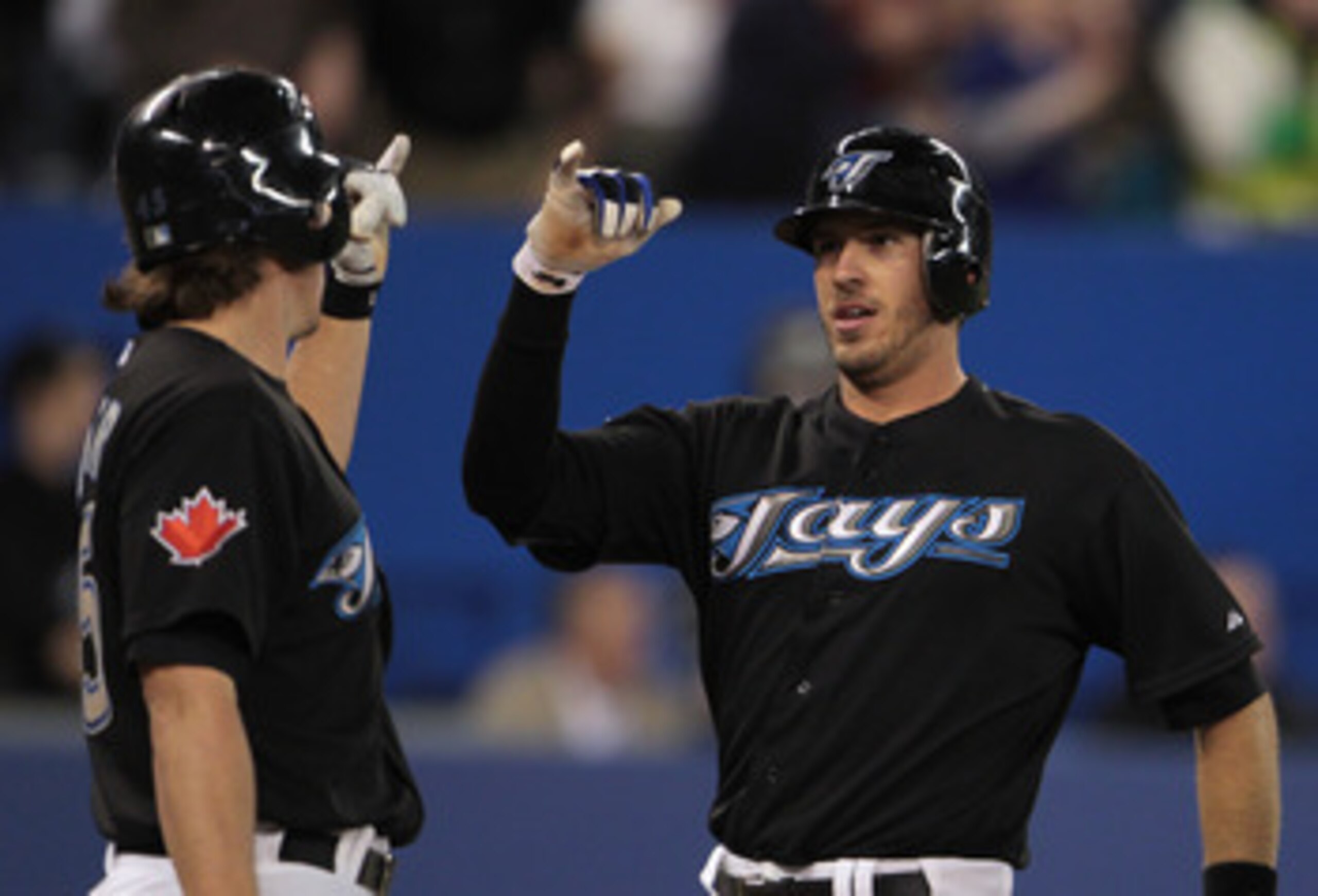 TORONTO, ON - APRIL 20:  J.P. Arencibia #9 of the Toronto Blue Jays (R) celebrates his home run in the second inning with Travis Snider #45 during their game with the New York Yankees at Rogers Centre on April 20, 2011 in Toronto, Canada.  (Photo by Scott