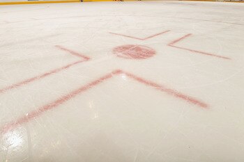 DENVER - NOVEMBER 09:  A detail of a face off circle as the ice sheet is prepared for the game as the Calgary Flames prepare to face the Colorado Avalanche at the Pepsi Center on November 9, 2010 in Denver, Colorado. The Flames defeated the Avalanche 4-2.
