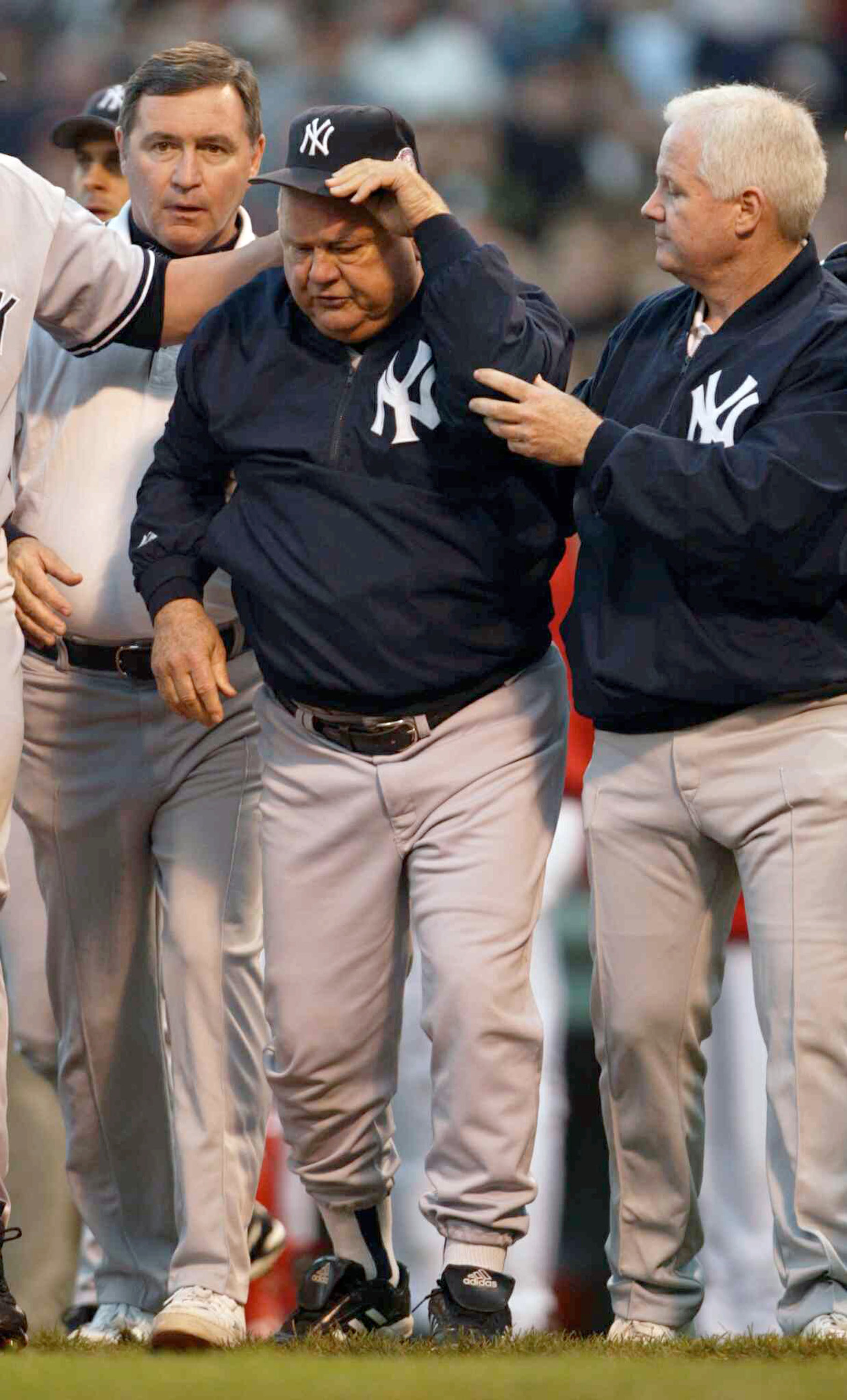 BOSTON - OCTOBER 11: Bench coach Don Zimmer of the New York Yankees walks off the field after being thrown on the ground by Pedro Martinez #45 of the Boston Red Sox after he thought a pitch was thrown at him during Game 3 of the 2003 American League Cham BOSTON - OCTOBER 11: Bench coach Don Zimmer of the New York Yankees walks off the field after being thrown on the ground by Pedro Martinez #45 of the Boston Red Sox after he thought a pitch was thrown at him during Game 3 of the 2003 American League Cham