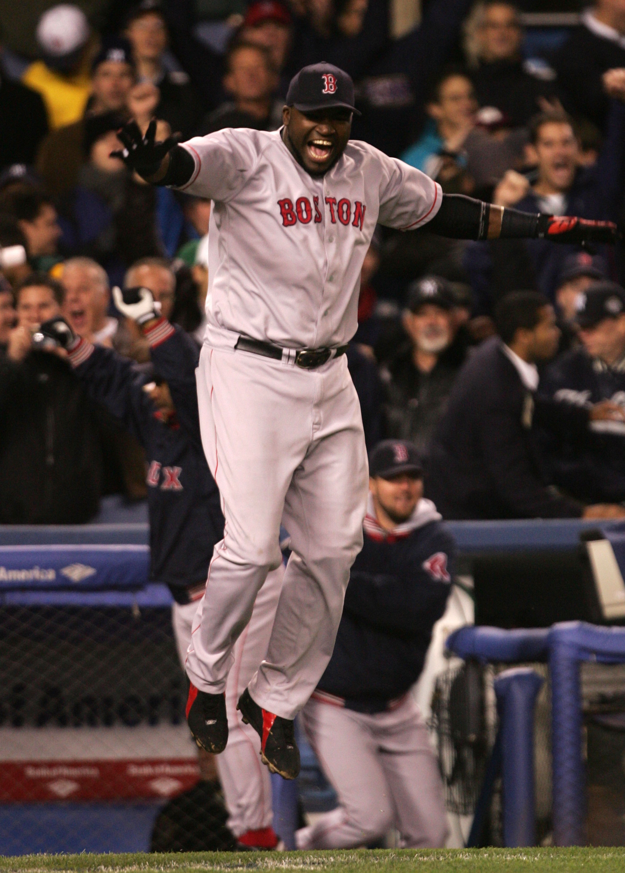 NEW YORK - OCTOBER 20:  David Ortiz #34 of the Boston Red Sox celebrates after defeating the New York Yankees 10-3 in game seven of the American League Championship Series on October 20, 2004 at Yankee Stadium in the Bronx borough of New York City. (Photo