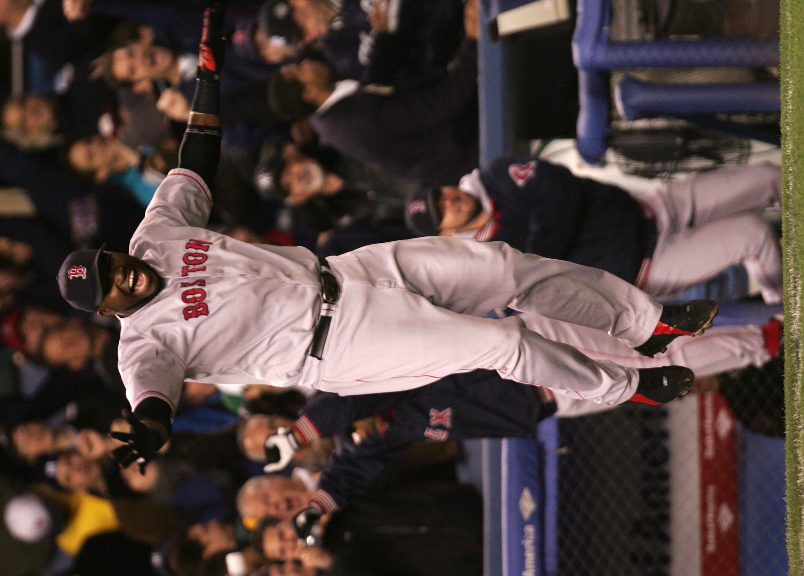 NEW YORK - OCTOBER 20:  David Ortiz #34 of the Boston Red Sox celebrates after defeating the New York Yankees 10-3 in game seven of the American League Championship Series on October 20, 2004 at Yankee Stadium in the Bronx borough of New York City. (Photo