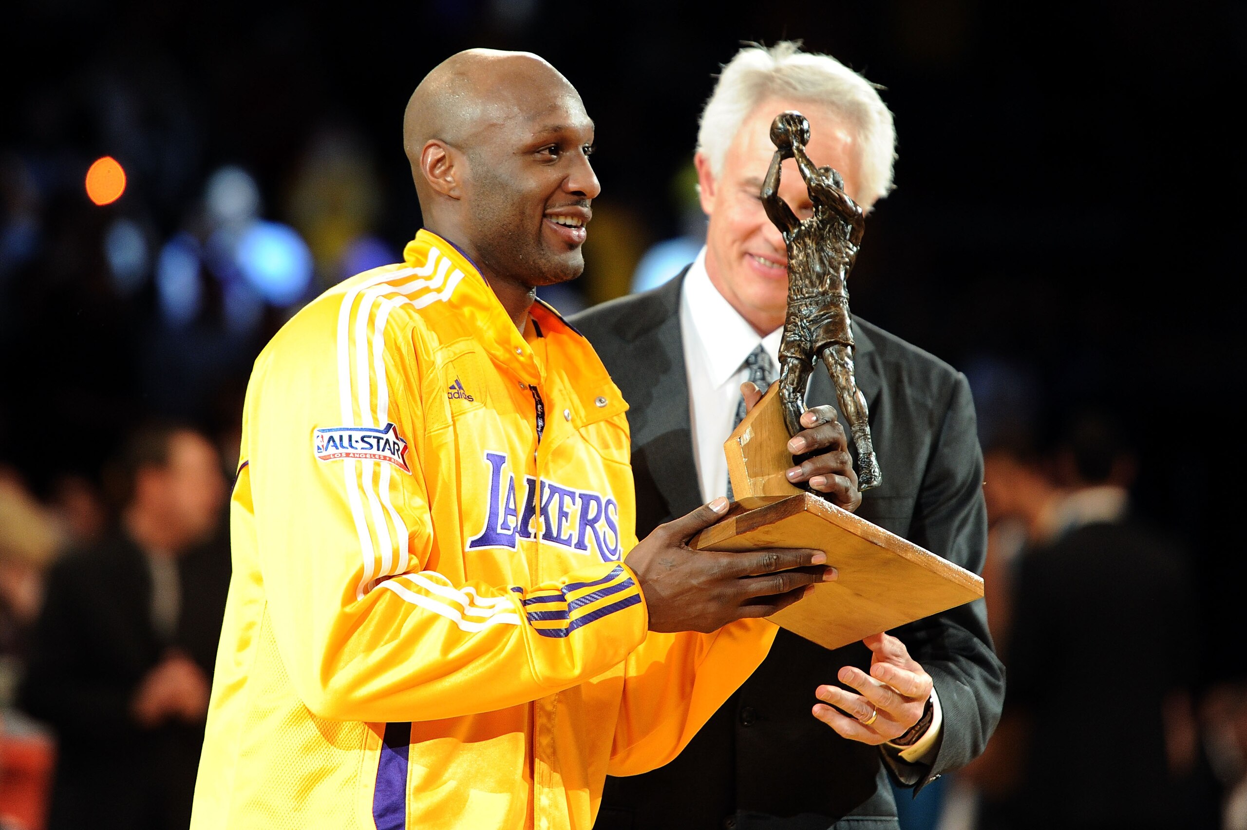 LOS ANGELES, CA - APRIL 20:  Lamar Odom #7 of the Los Angeles Lakers receives the Kia Six Man of the Year Award from Lakers General Manager Mitch Kupchak before Game Two of the Western Conference Quarterfinals in the 2011 NBA Playoffs against the New Orle