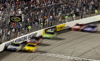RICHMOND, VA - SEPTEMBER 11:  Denny Hamlin, driver of the #11 FedEx Office Toyota, and Clint Bowyer, driver of the #33Cheerios/Hamburger Helper Chevrolet, lead the field during the NASCAR Sprint Cup Series Air Guard 400 at Richmond International Raceway o