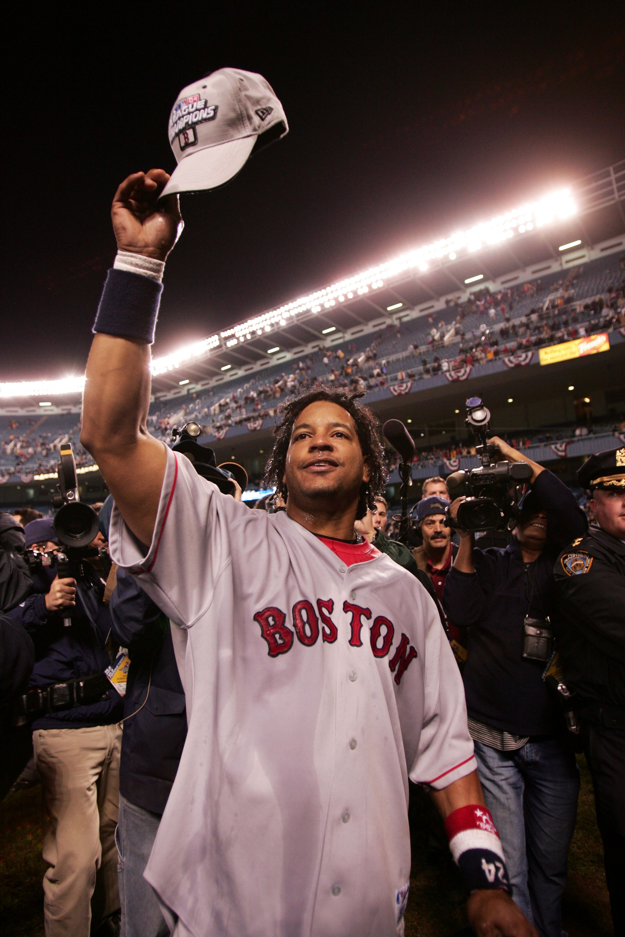 NEW YORK - OCTOBER 20:  Manny Ramirez #24 of the Boston Red Sox celebrates after defeating the New York Yankees 10-3 to win game seven of the American League Championship Series on October 20, 2004 at Yankee Stadium in the Bronx borough of New York City.