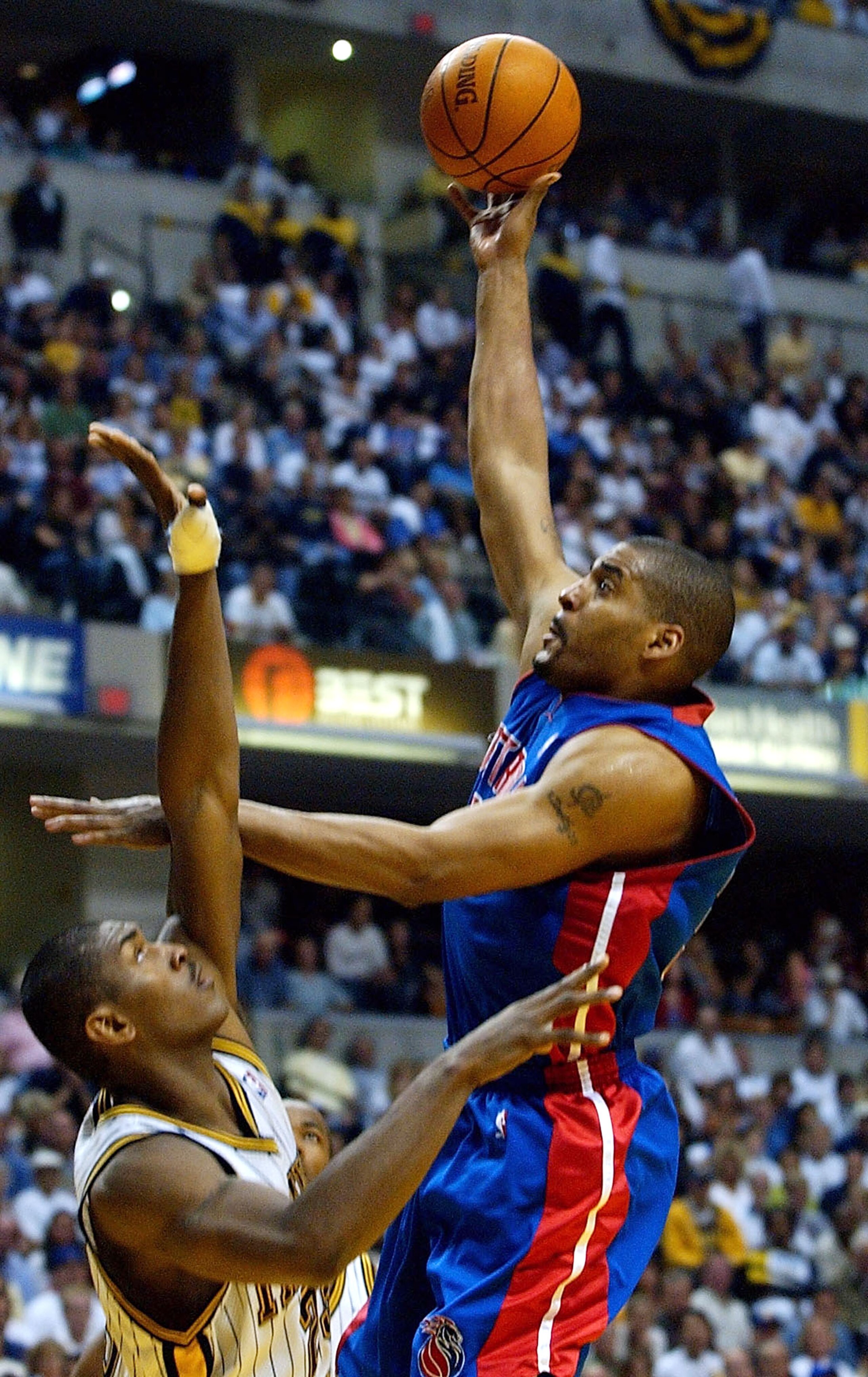 INDIANAPOLIS - MAY 30:  Corliss Williamson #34 of the Detroit Pistons shoots over Ron Artest #23 of the Indiana Pacers in Game five of the Eastern Conference Finals during the 2004 NBA Playoffs at Conseco Fieldhouse on May 30, 2004 in Indianapolis, Indian