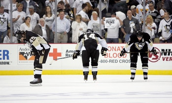 PITTSBURGH, PA - APRIL 27:  Arron Asham #45, Chris Kunitz #14 and Jordan Staal #11 of the Pittsburgh Penguins react after losing to the Tampa Bay Lightning in Game Seven of the Eastern Conference Quarterfinals during the 2011 NHL Stanley Cup Playoffs at C