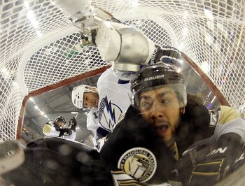 PITTSBURGH, PA - APRIL 27:  Kris Letang #58 of the Pittsburgh Penguins and Pavel Kubina #13 of the Tampa Bay Lightning crash the net in Game Seven of the Eastern Conference Quarterfinals during the 2011 NHL Stanley Cup Playoffs at Consol Energy Center on